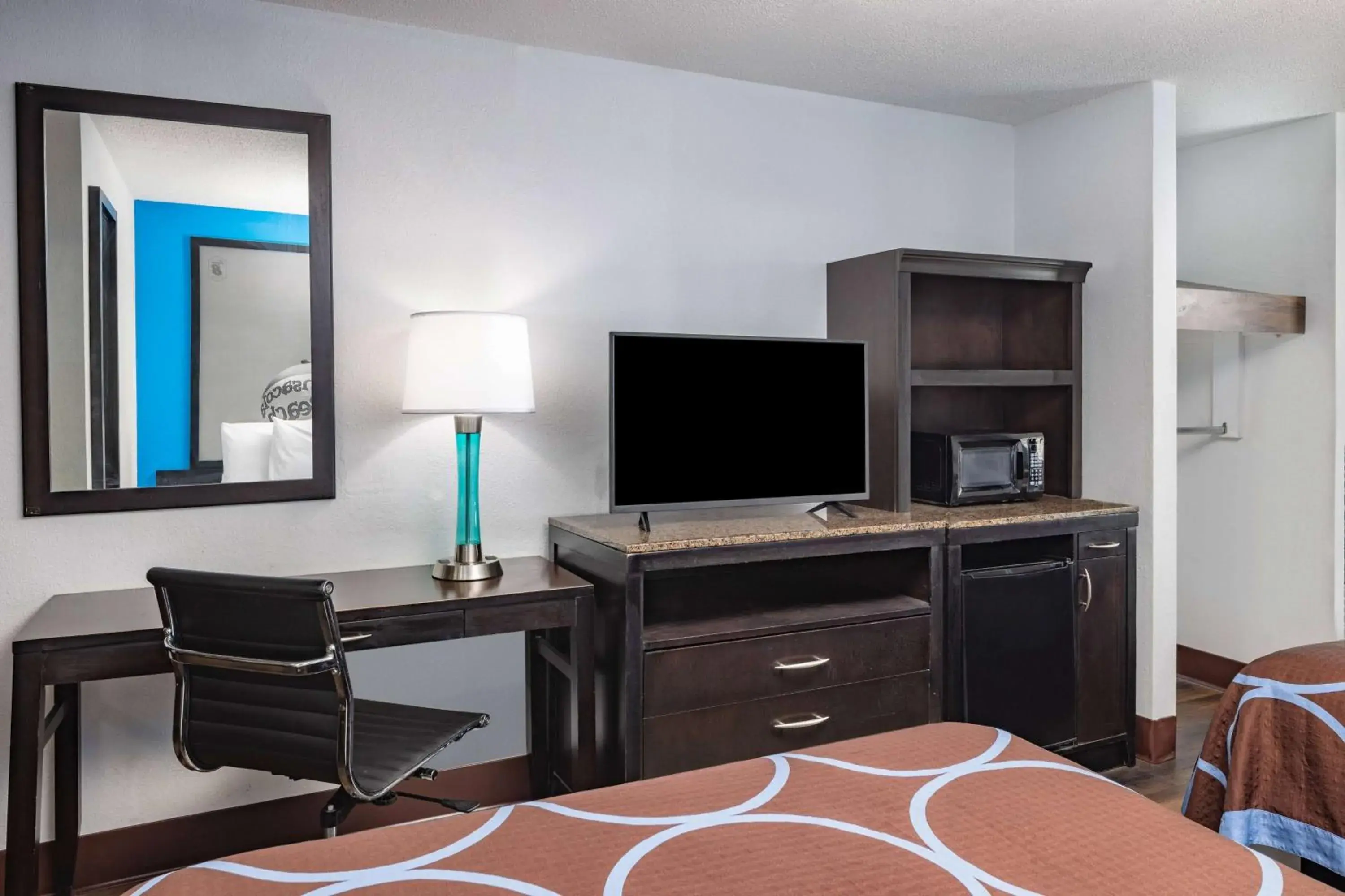 Photo of the whole room, TV/Entertainment Center in Super 8 by Wyndham Pensacola