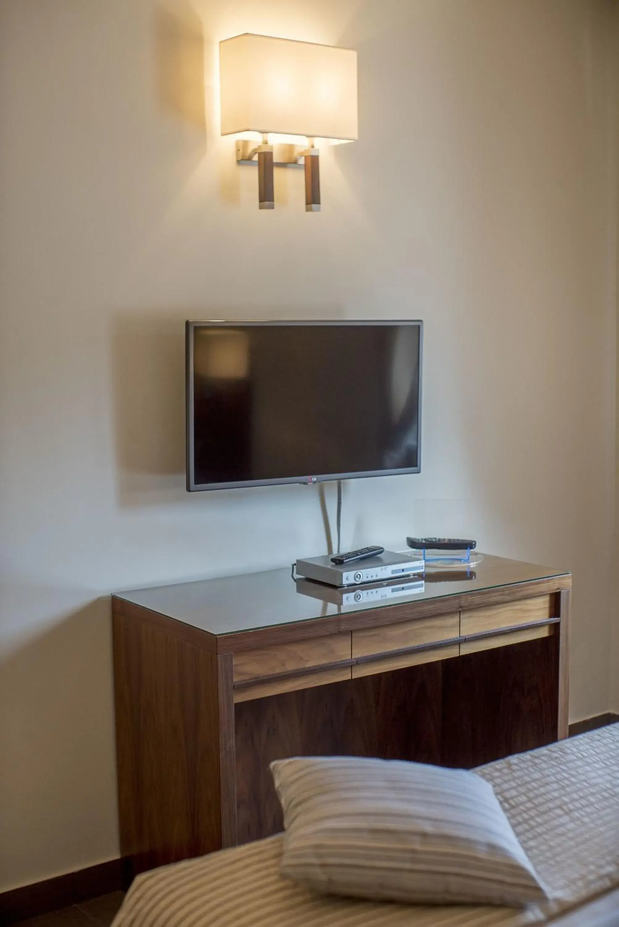 TV and multimedia, TV/Entertainment Center in Suites & Residence Hotel