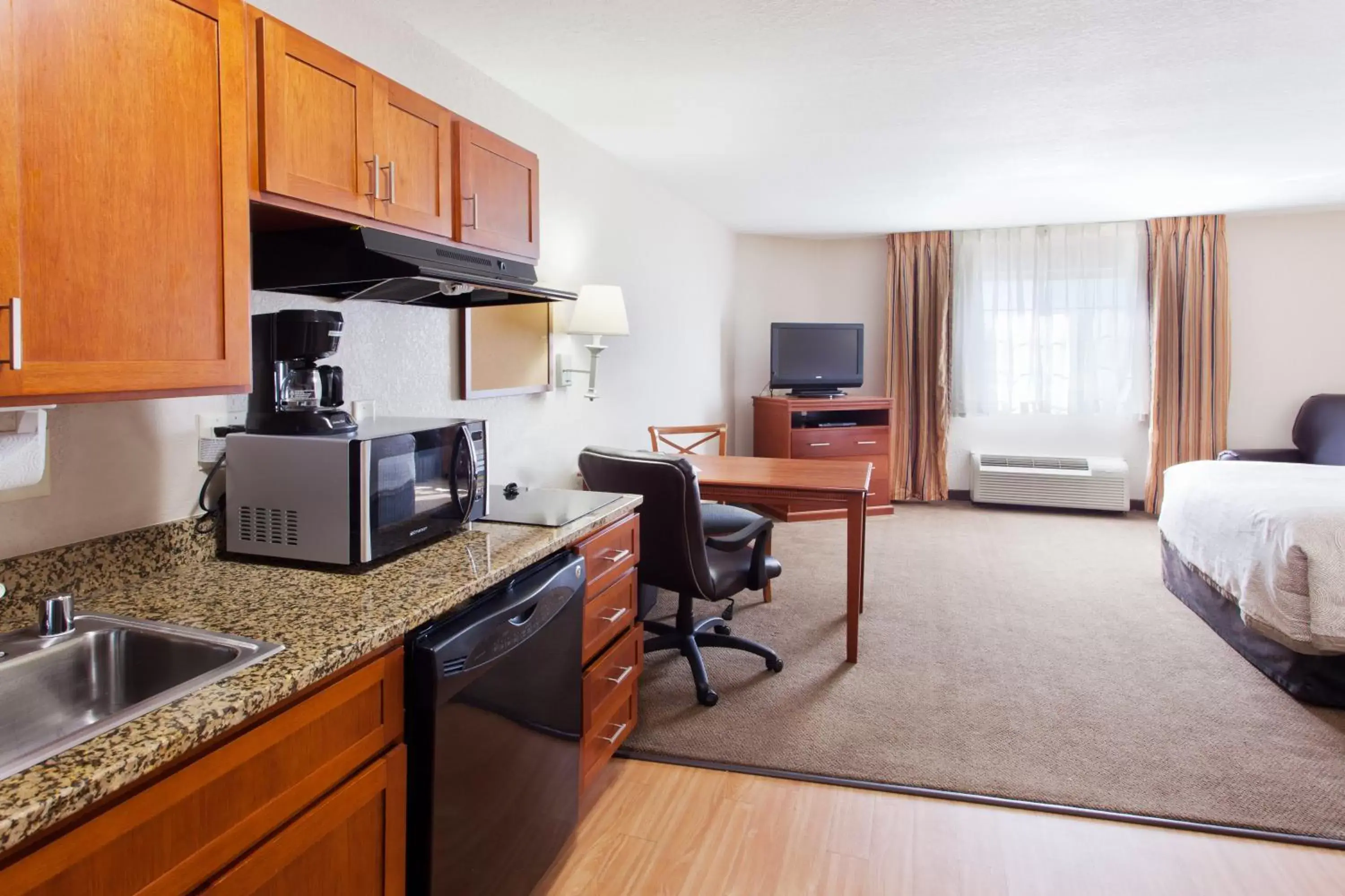 Photo of the whole room, Kitchen/Kitchenette in Candlewood Suites Lexington, an IHG Hotel