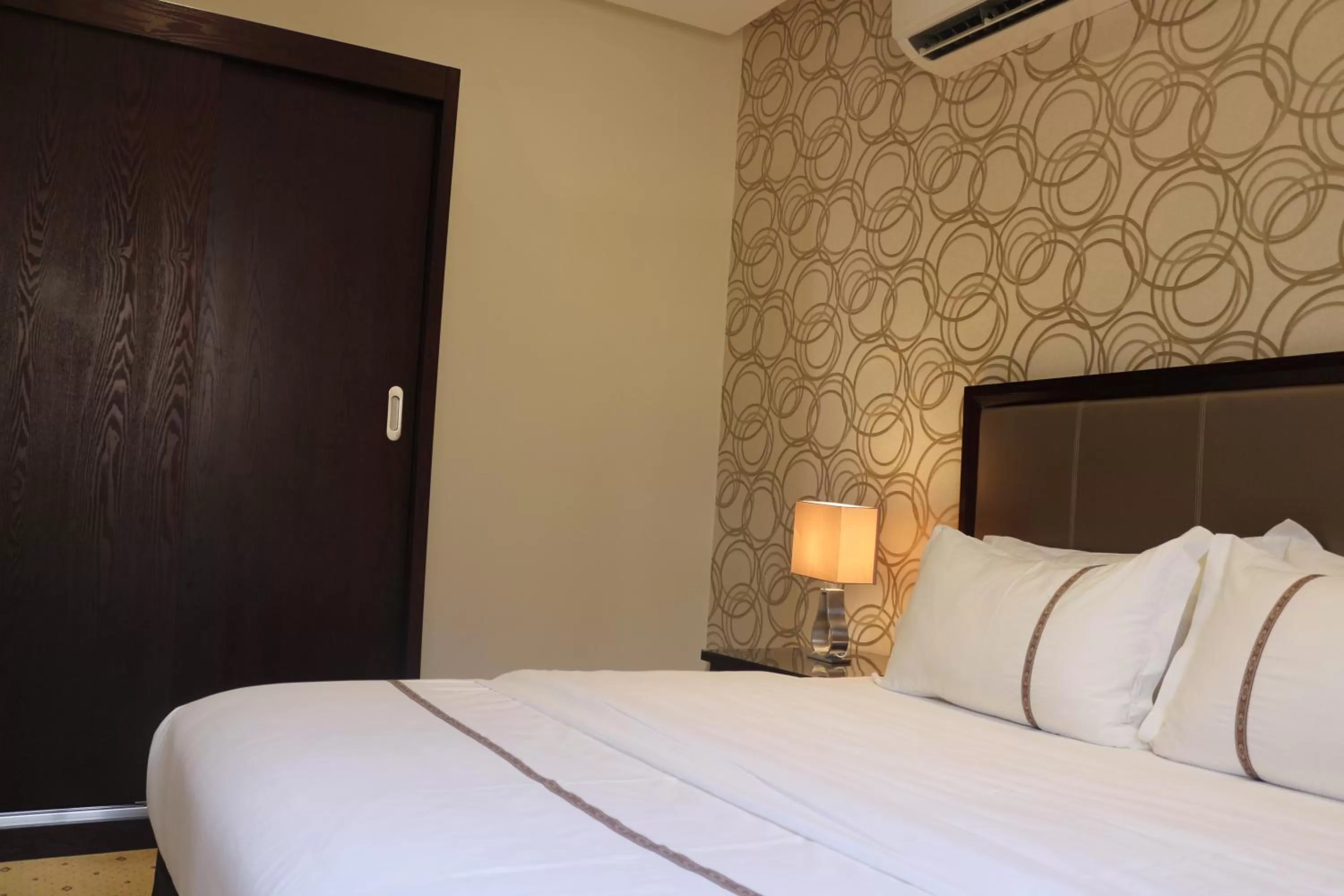 Bed in Nooryana Suites Boutique