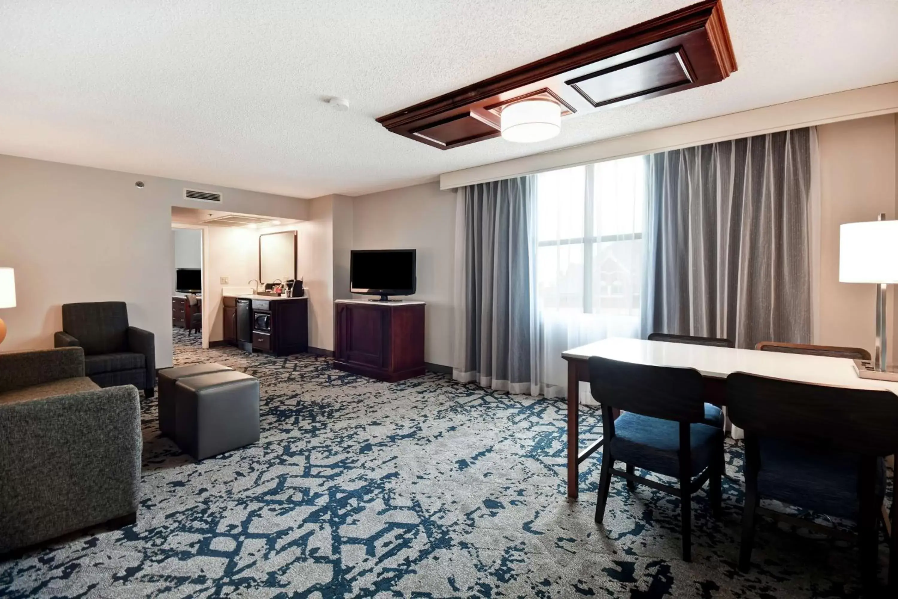 Bedroom, Seating Area in Embassy Suites Montgomery - Hotel & Conference Center