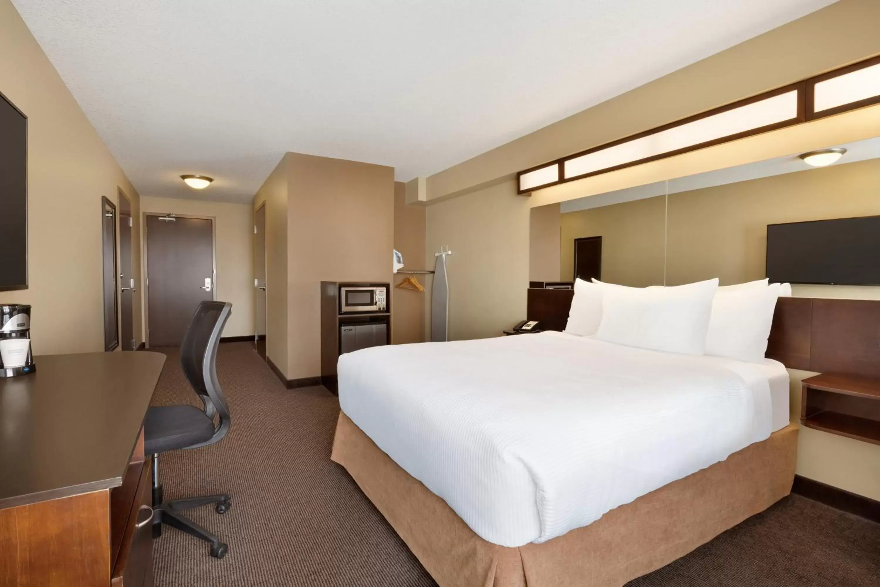 Bed in Microtel Inn and Suites by Wyndham Weyburn