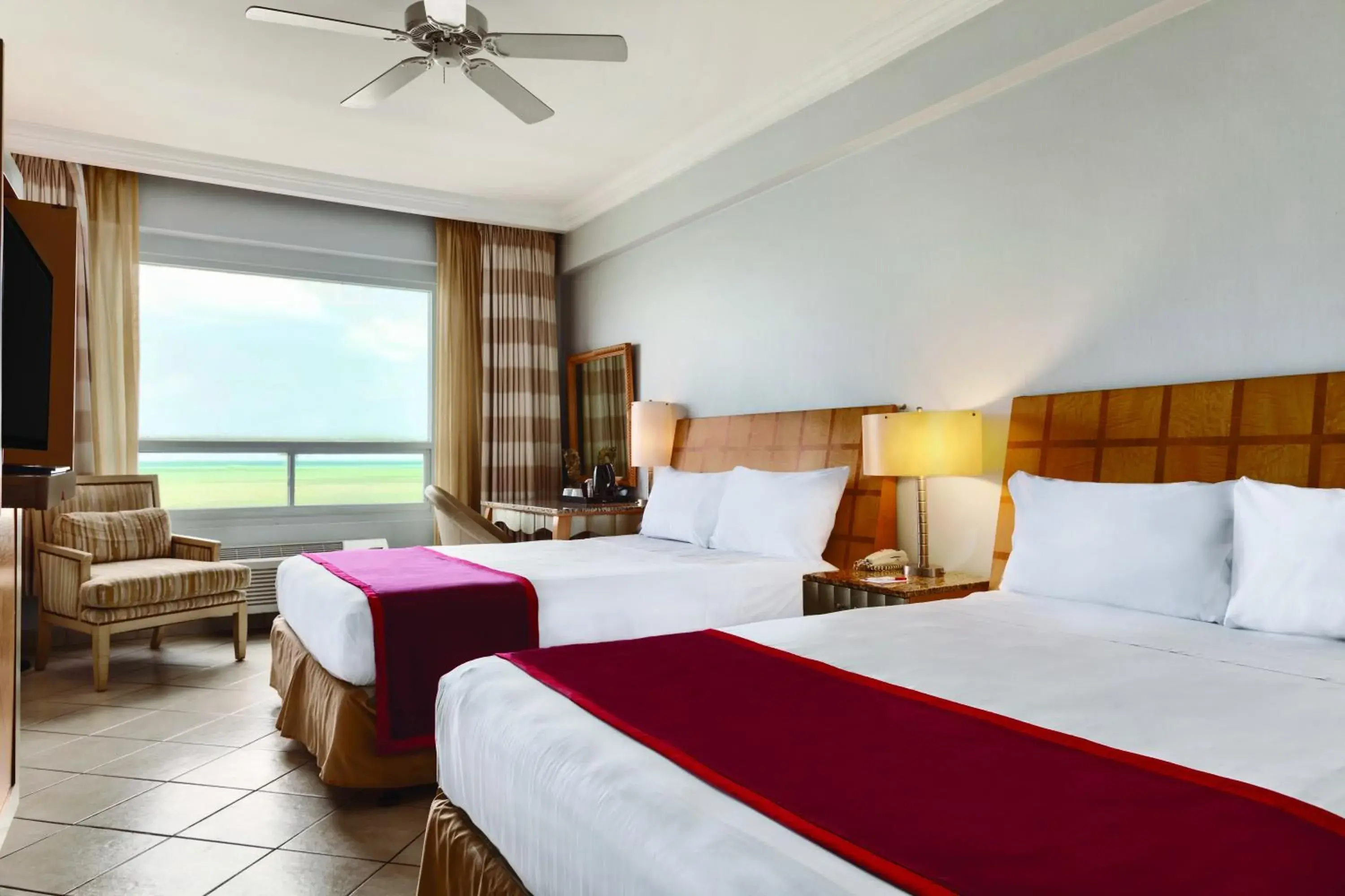 Bed in Ramada by Wyndham Princess Belize City