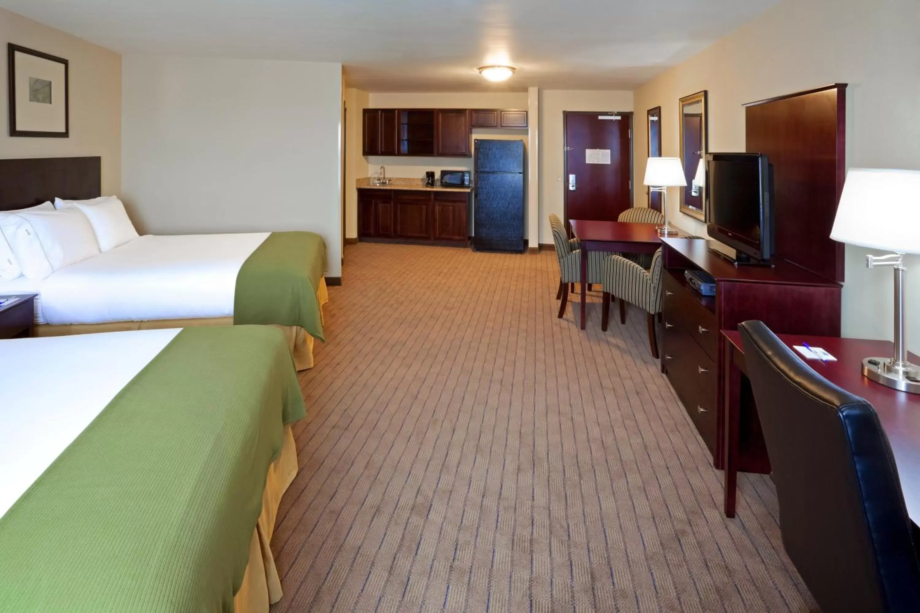 Bedroom in Holiday Inn Express Hotel & Suites Syracuse North Airport Area, an IHG Hotel