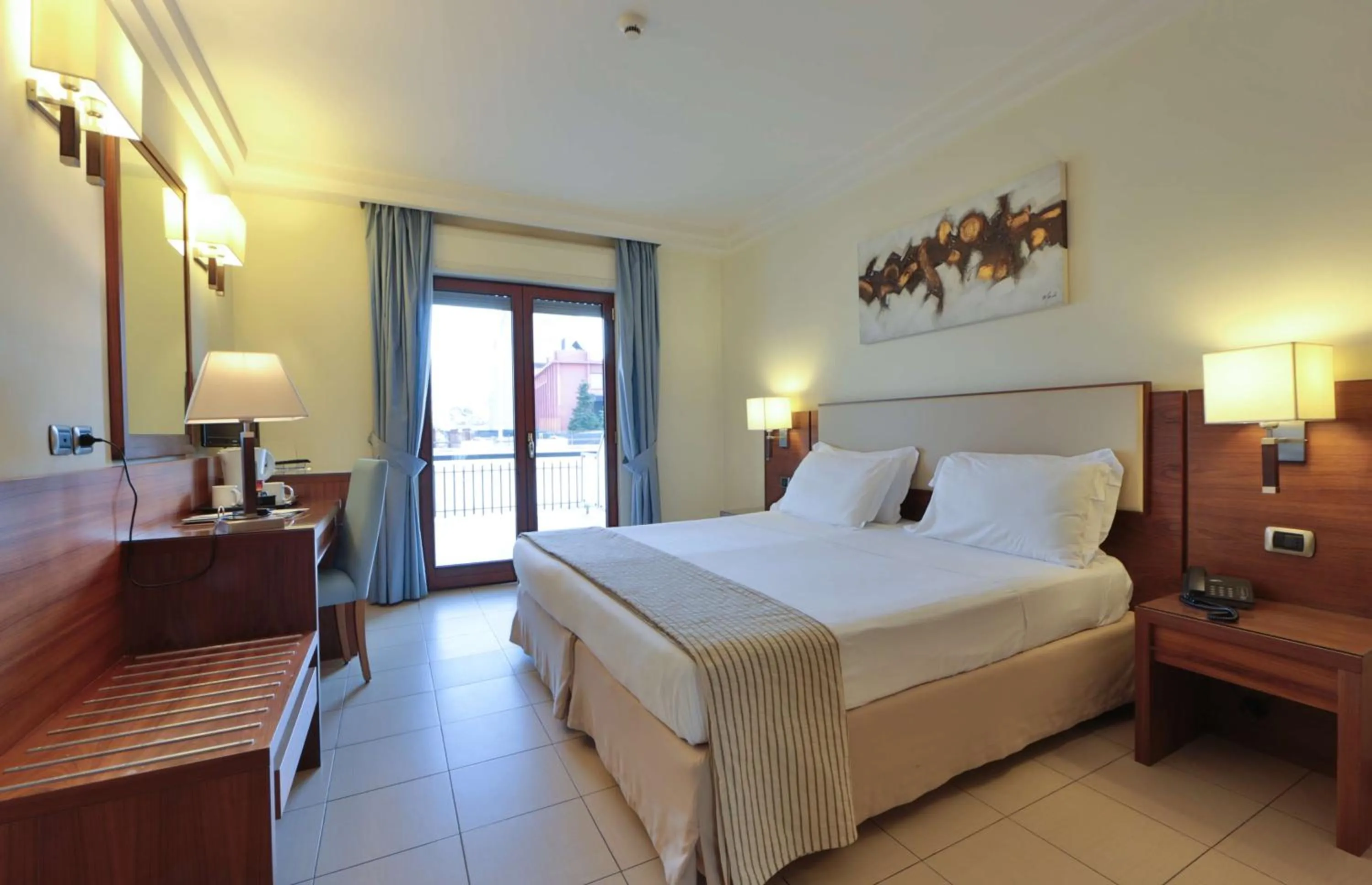 Bed in Suites & Residence Hotel