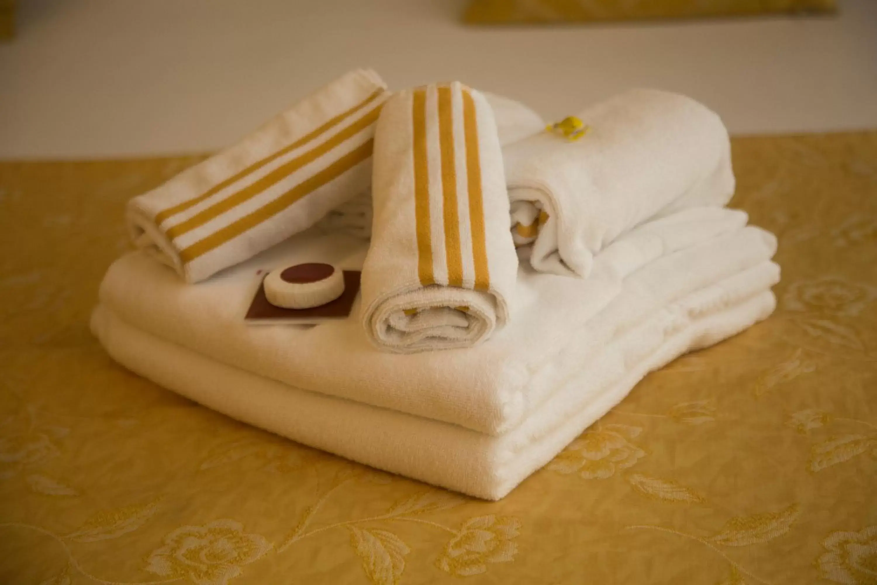 towels, Bed in B&B Art Suite Santa Brigida