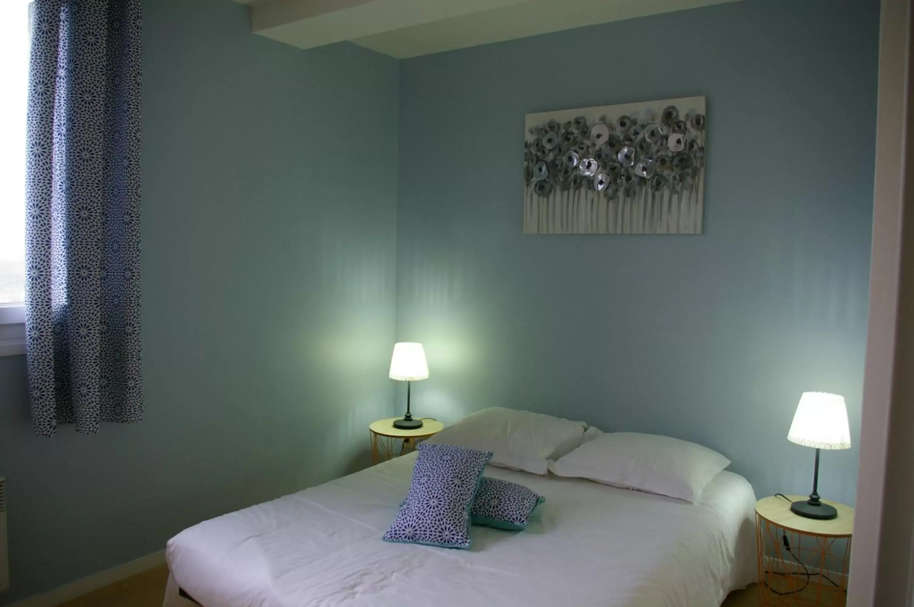 Bed in Queen Serenity Hotel
