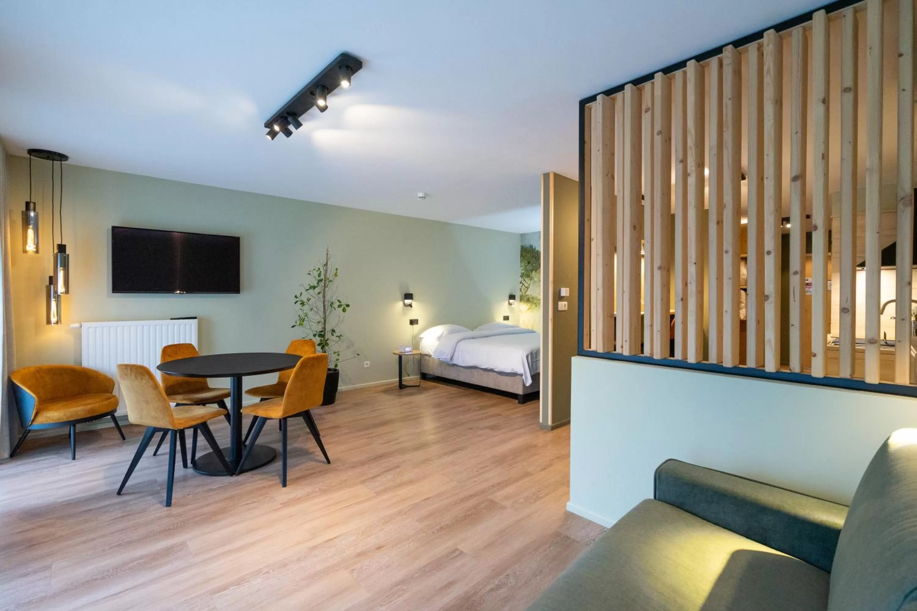 Communal lounge/ TV room, Bed in Appart hôtel En Ville