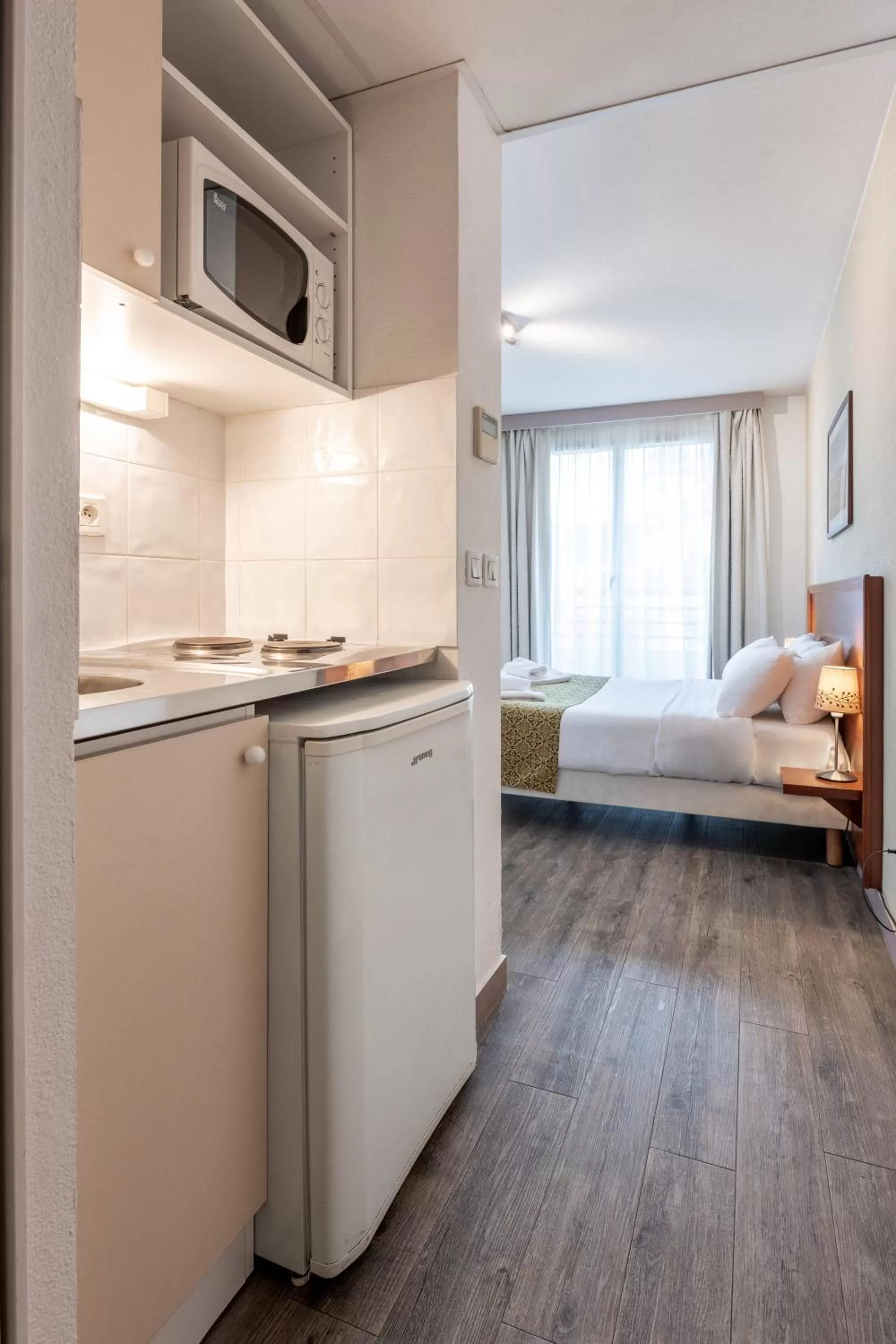 Kitchen or kitchenette, Bed in Residhotel Grenette