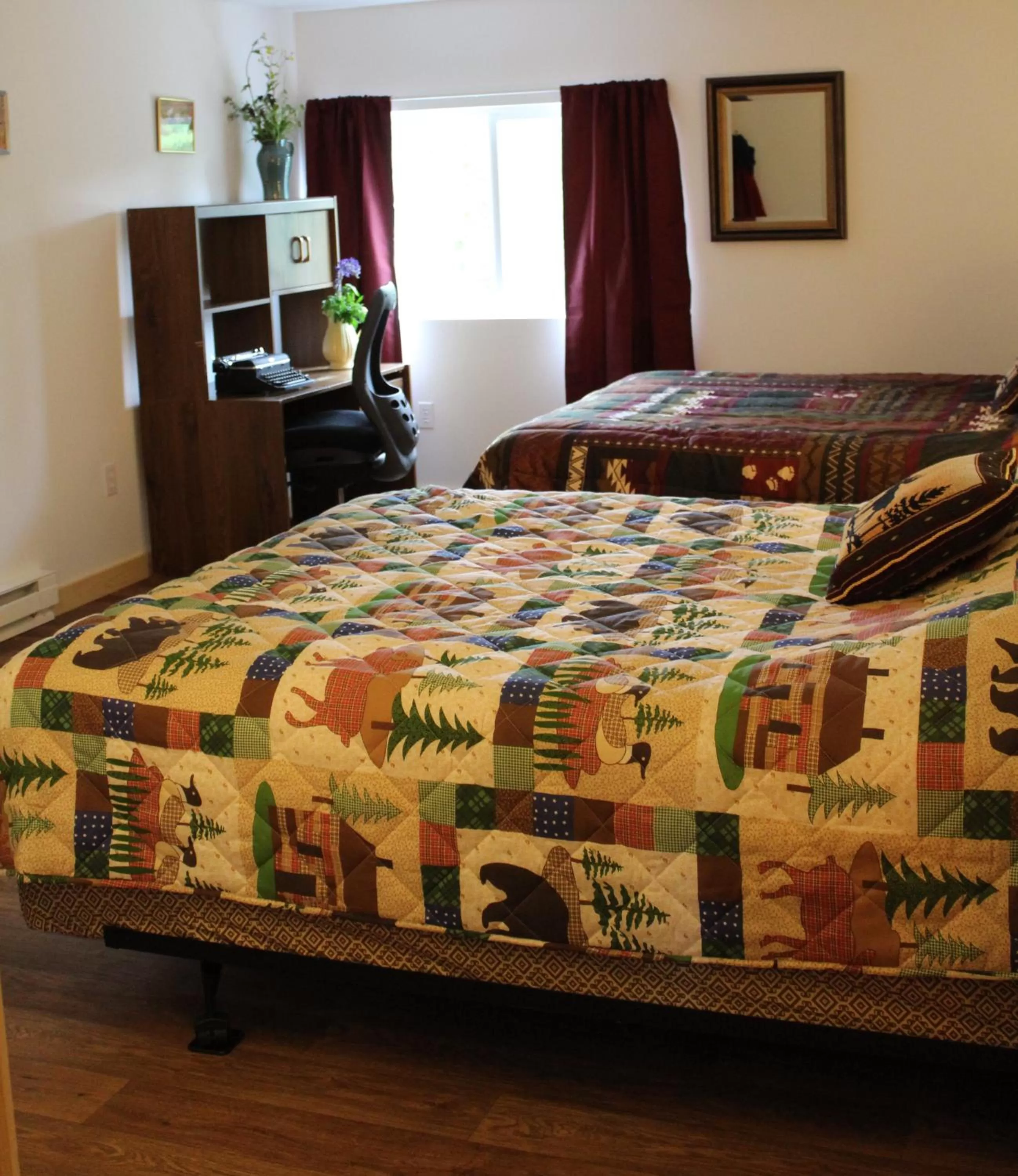 Bed in Whispering Winds Retreat B&B