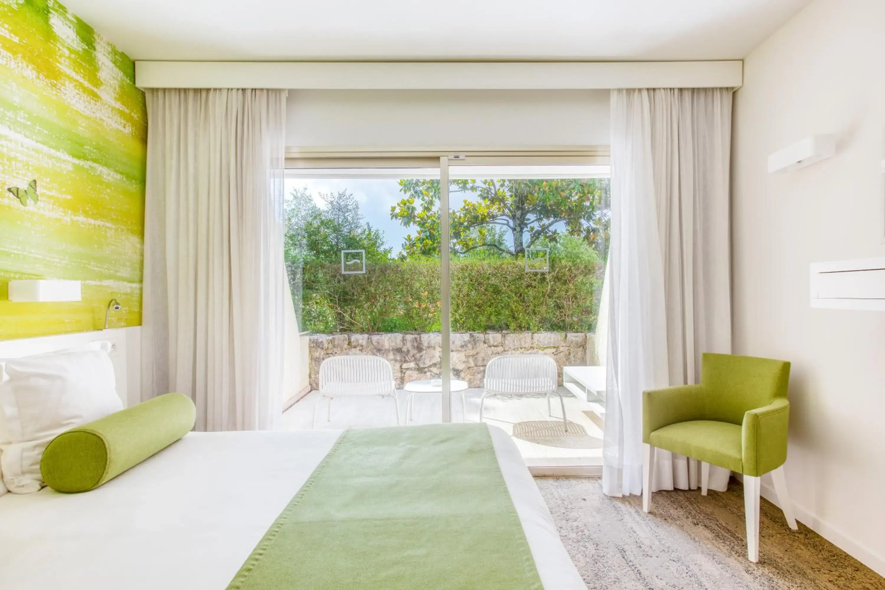 Bed, Seating Area in Hotel Restaurant La Vague de Saint Paul & Spa