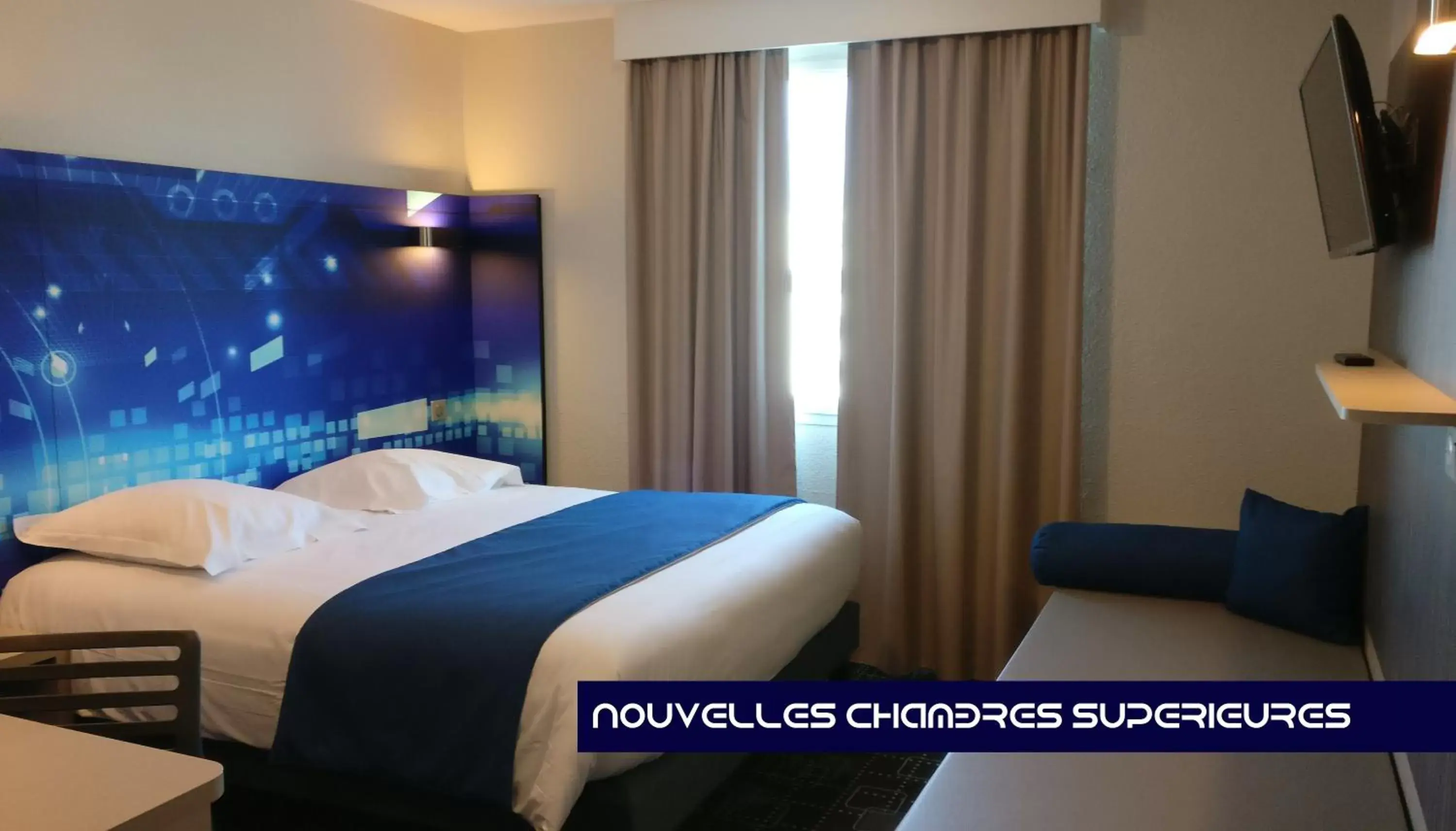 Photo of the whole room, Bed in Kyriad Poitiers Jules Verne Site du Futuroscope Photo of the whole room, Bed in Kyriad Poitiers Jules Verne Site du Futuroscope