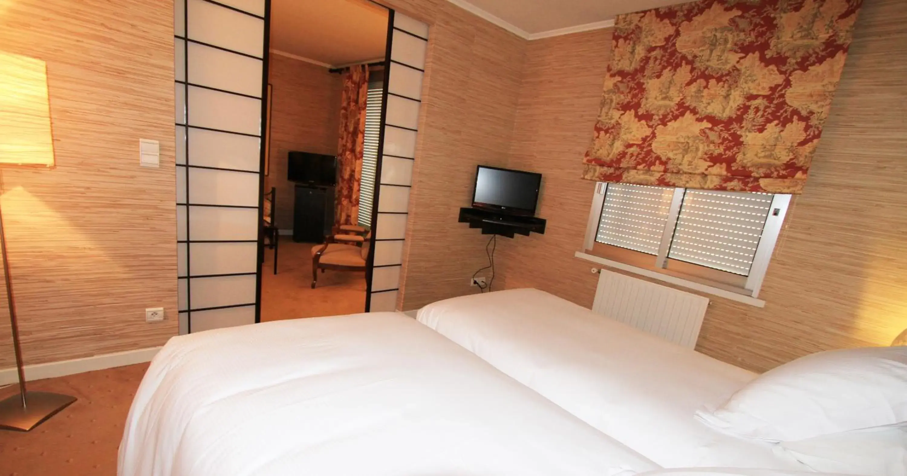 Bed, TV/Entertainment Center in Hostellerie Saint Antoine