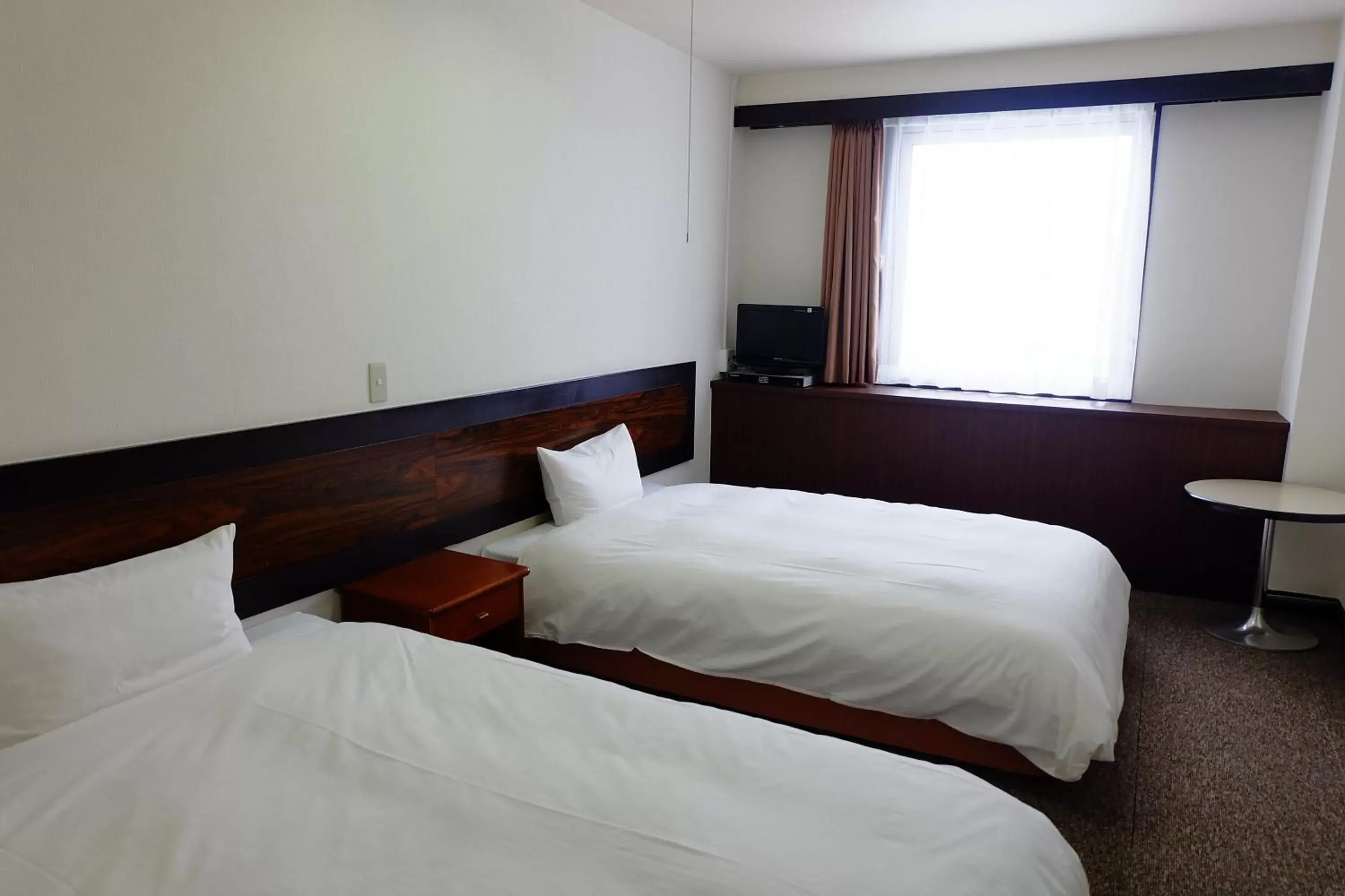 Bed in Tabist Hotel Tetora Hakodate Station