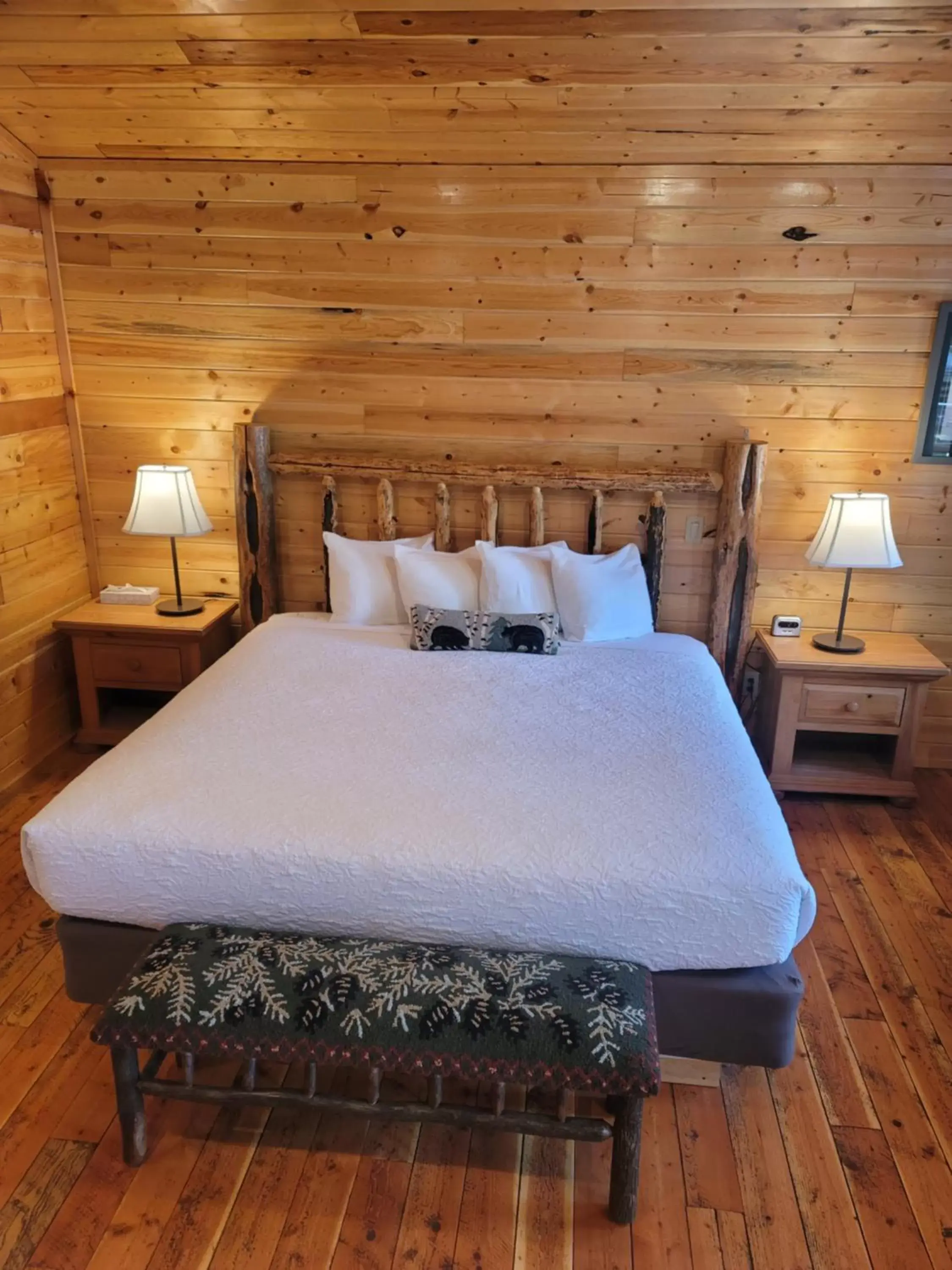 Bed in Riverfront Motel & Cabins