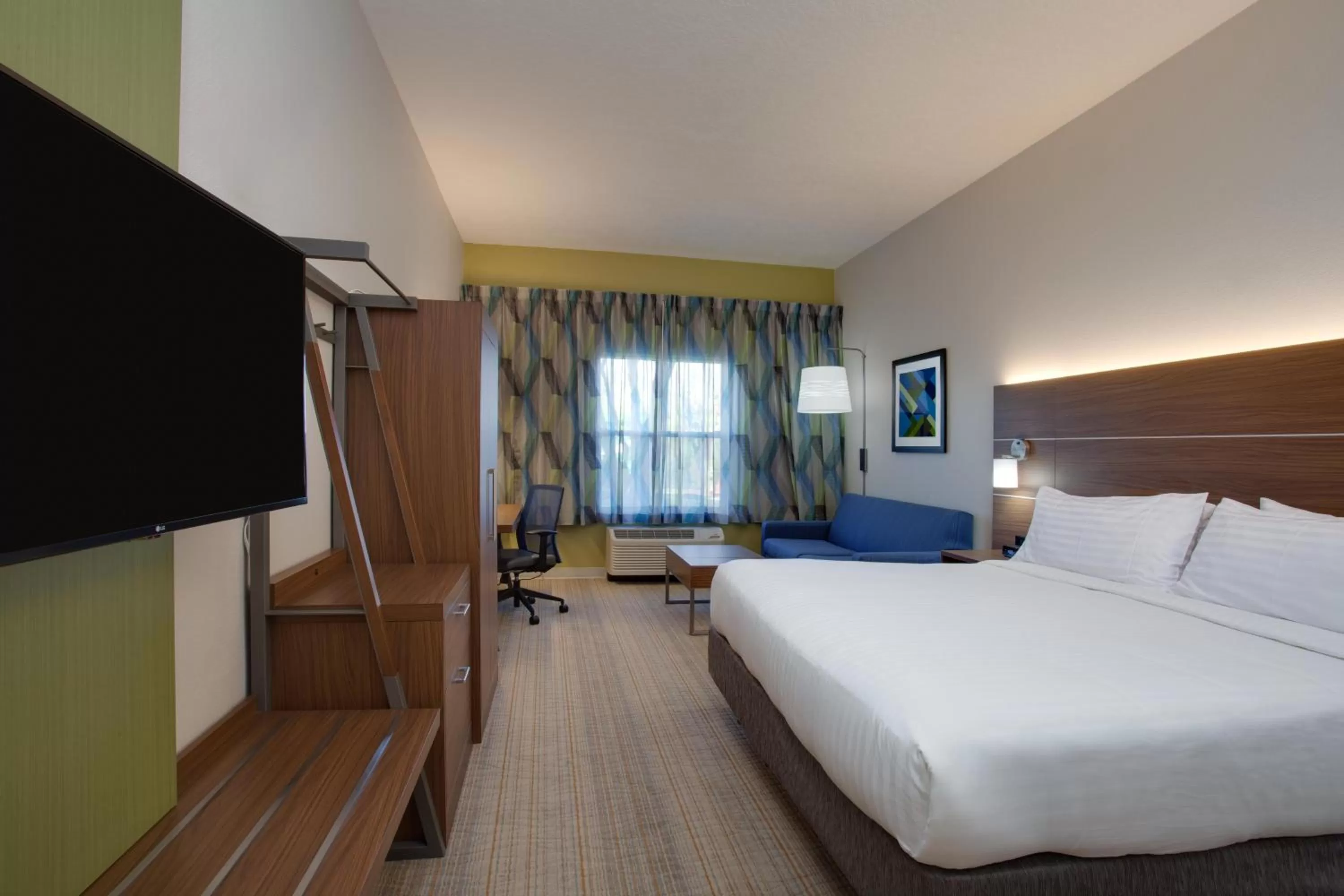 Bedroom, Bed in Holiday Inn Express & Suites Orlando International Airport by IHG