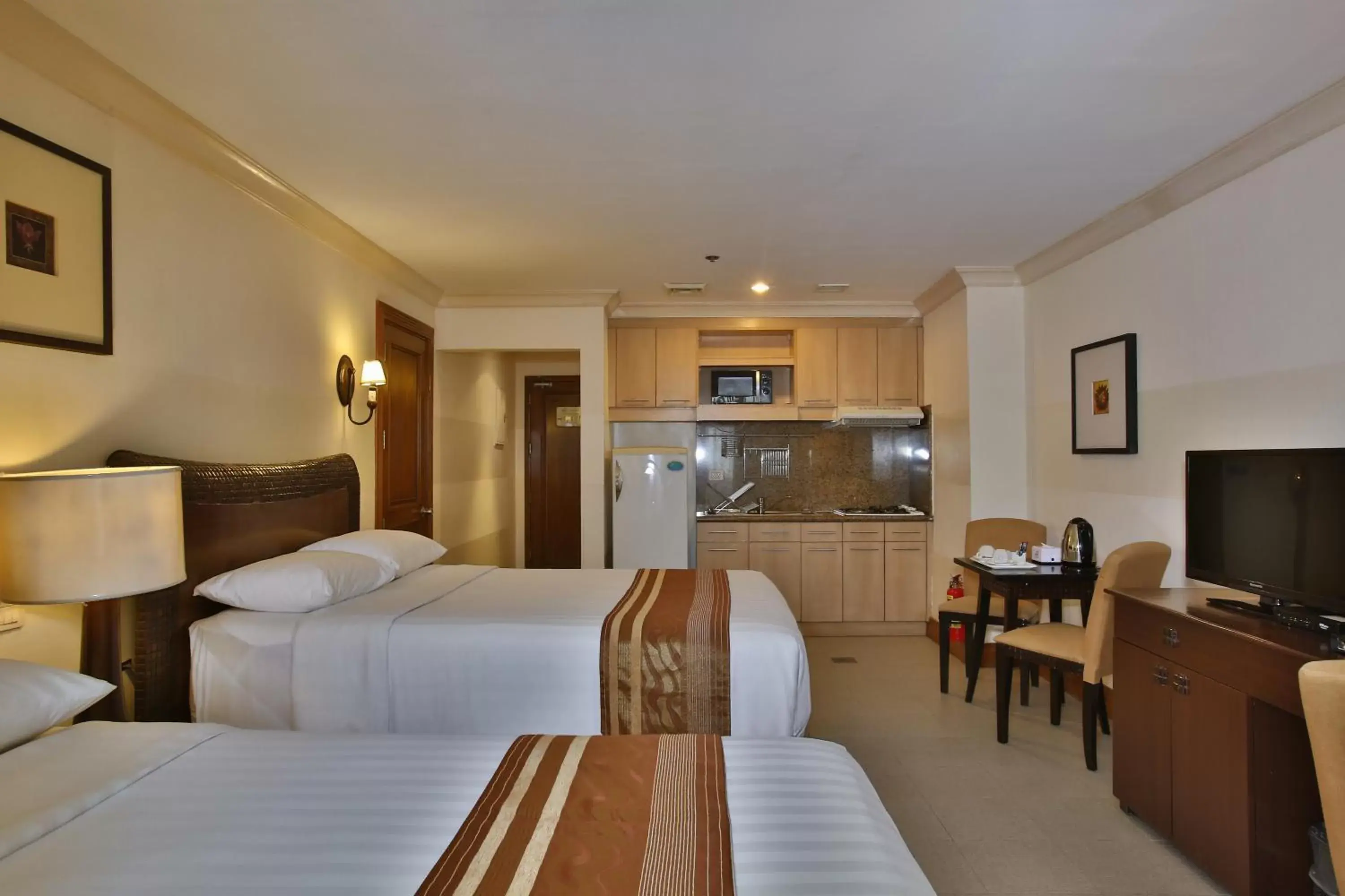 Bed in Crown Regency Suites Mactan