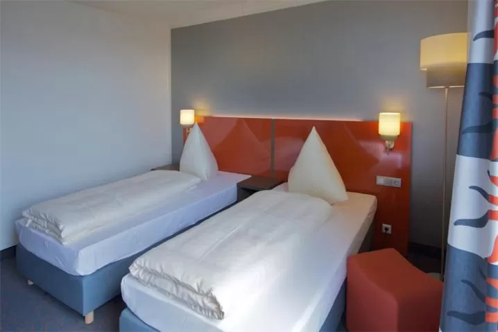 Bed in iQ-Hotel Ulm