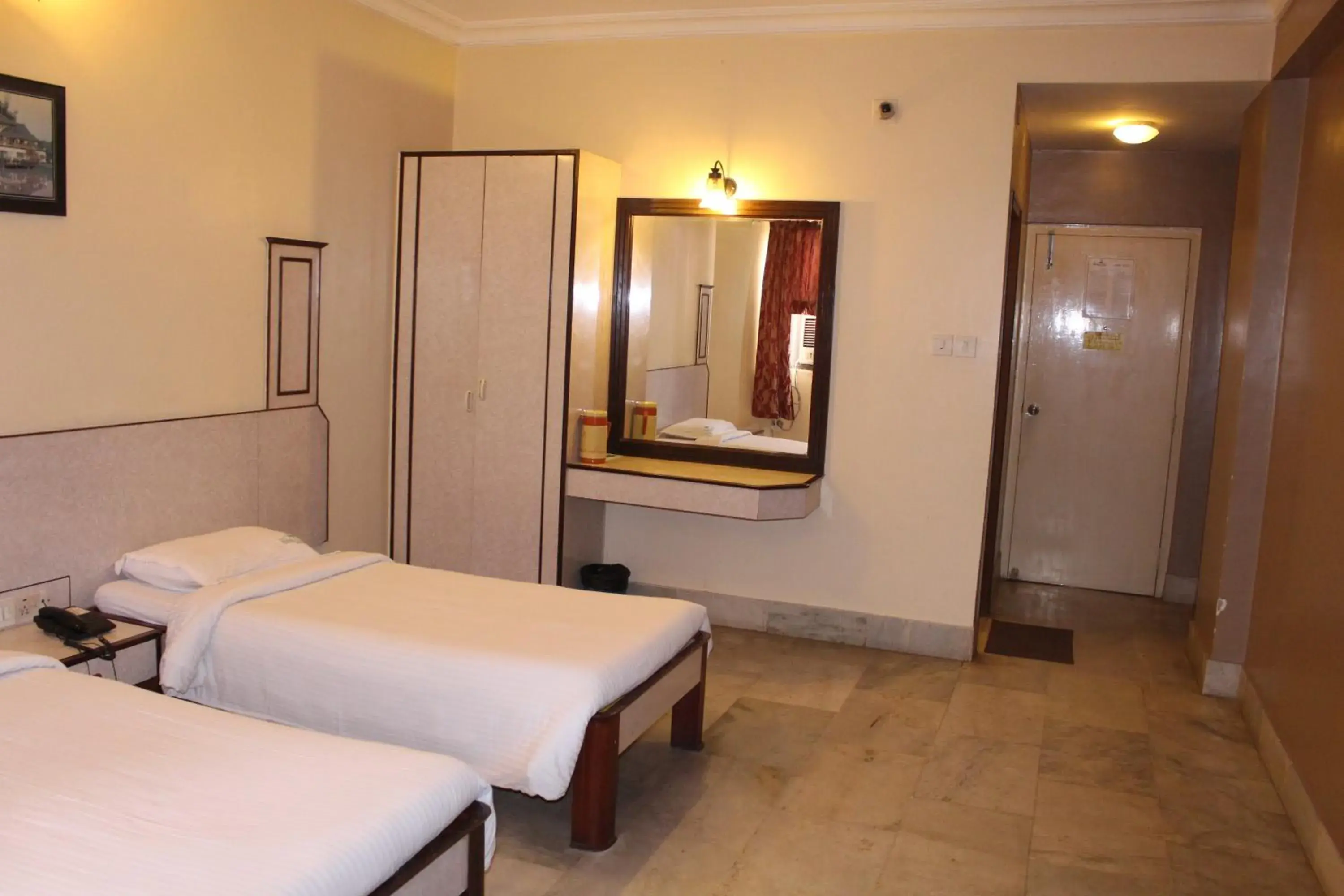 Photo of the whole room, Bed in Hotel Mangalore International