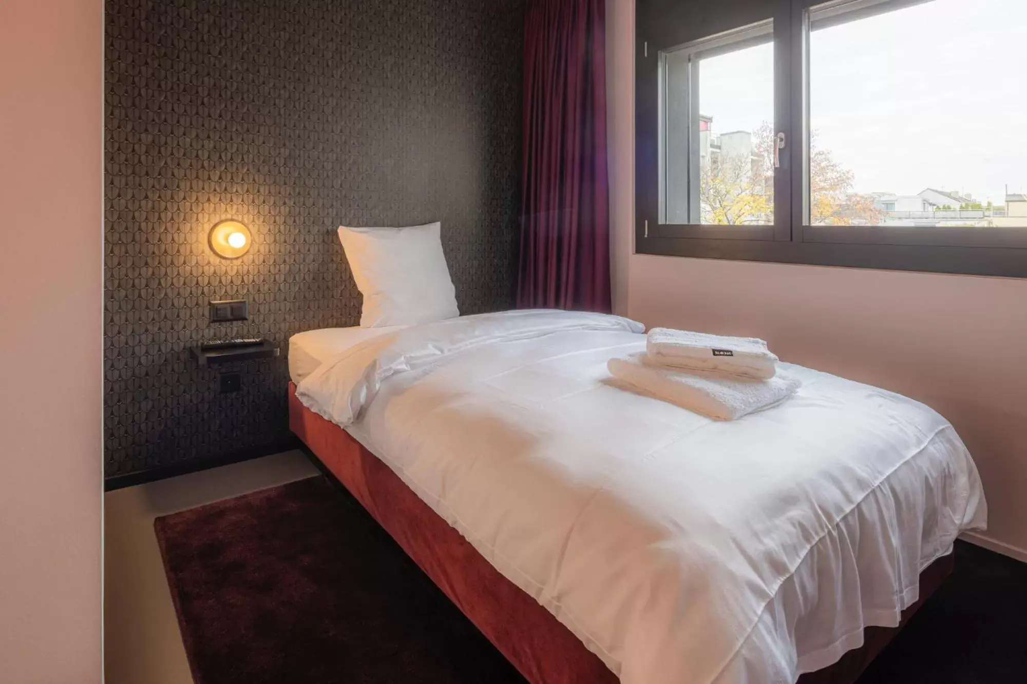 Bed in BLOOM Boutique Hotel & Lounge Basel