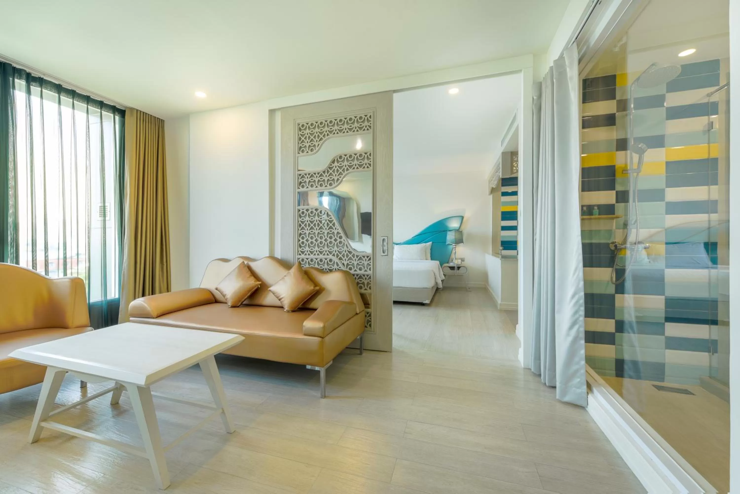 Seating area, Bed in Le Tada Parkview Hotel