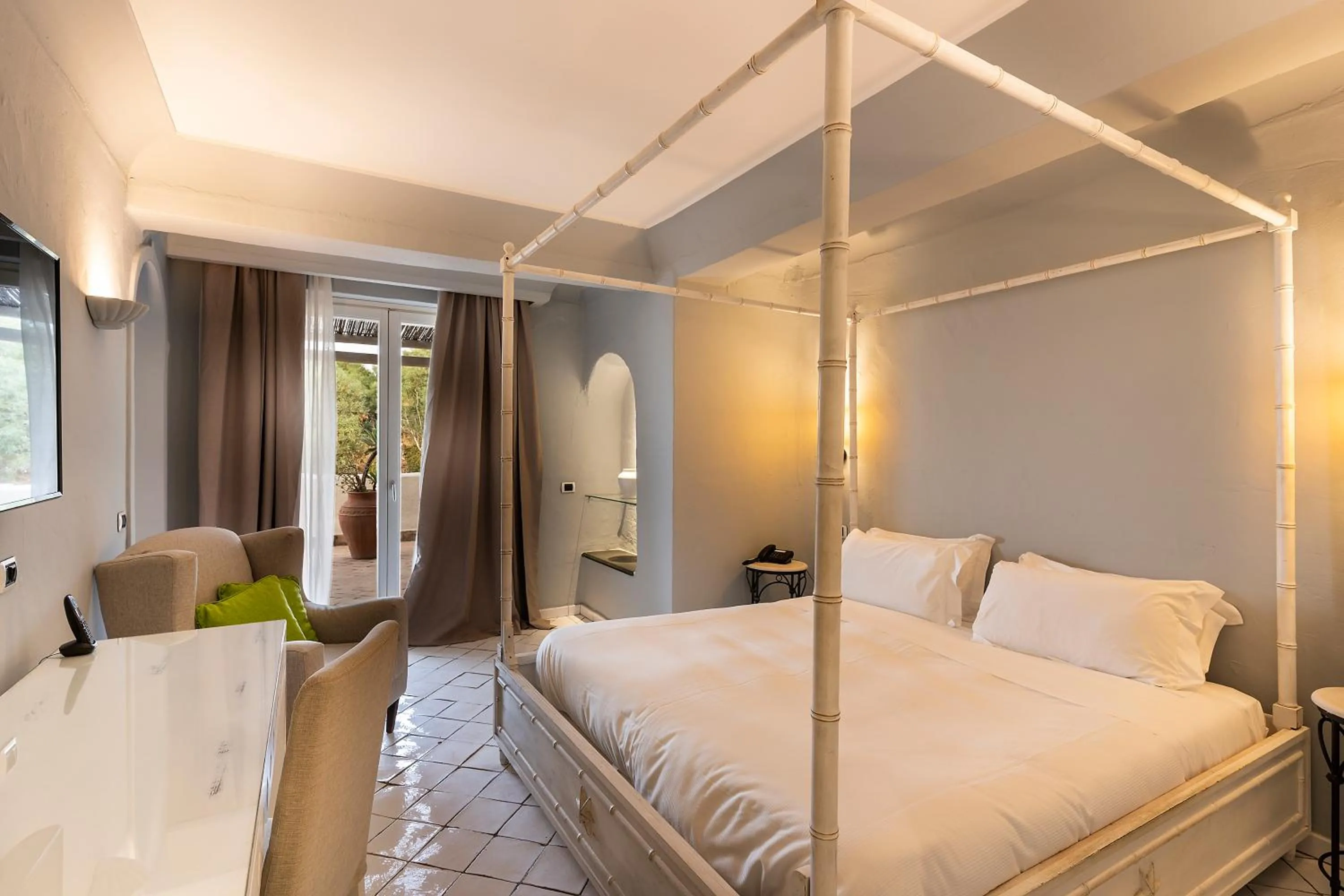 Bed in Therasia Resort Sea and SPA - The Leading Hotels of the World