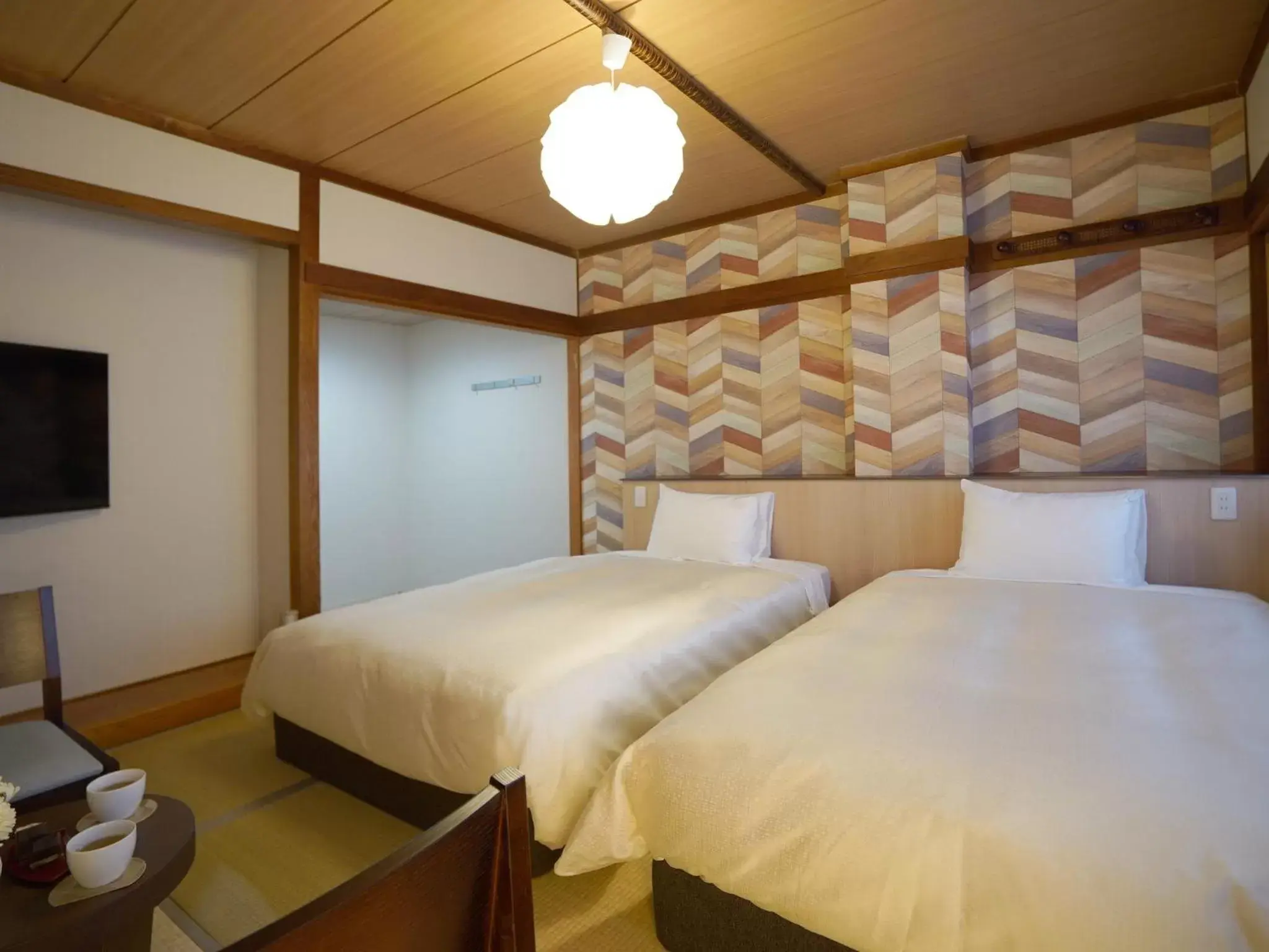 Photo of the whole room, Bed in Hotel New Gaea Iizuka