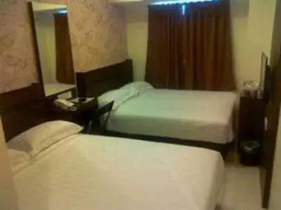 Photo of the whole room, Bed in The Regency Garden Hotel