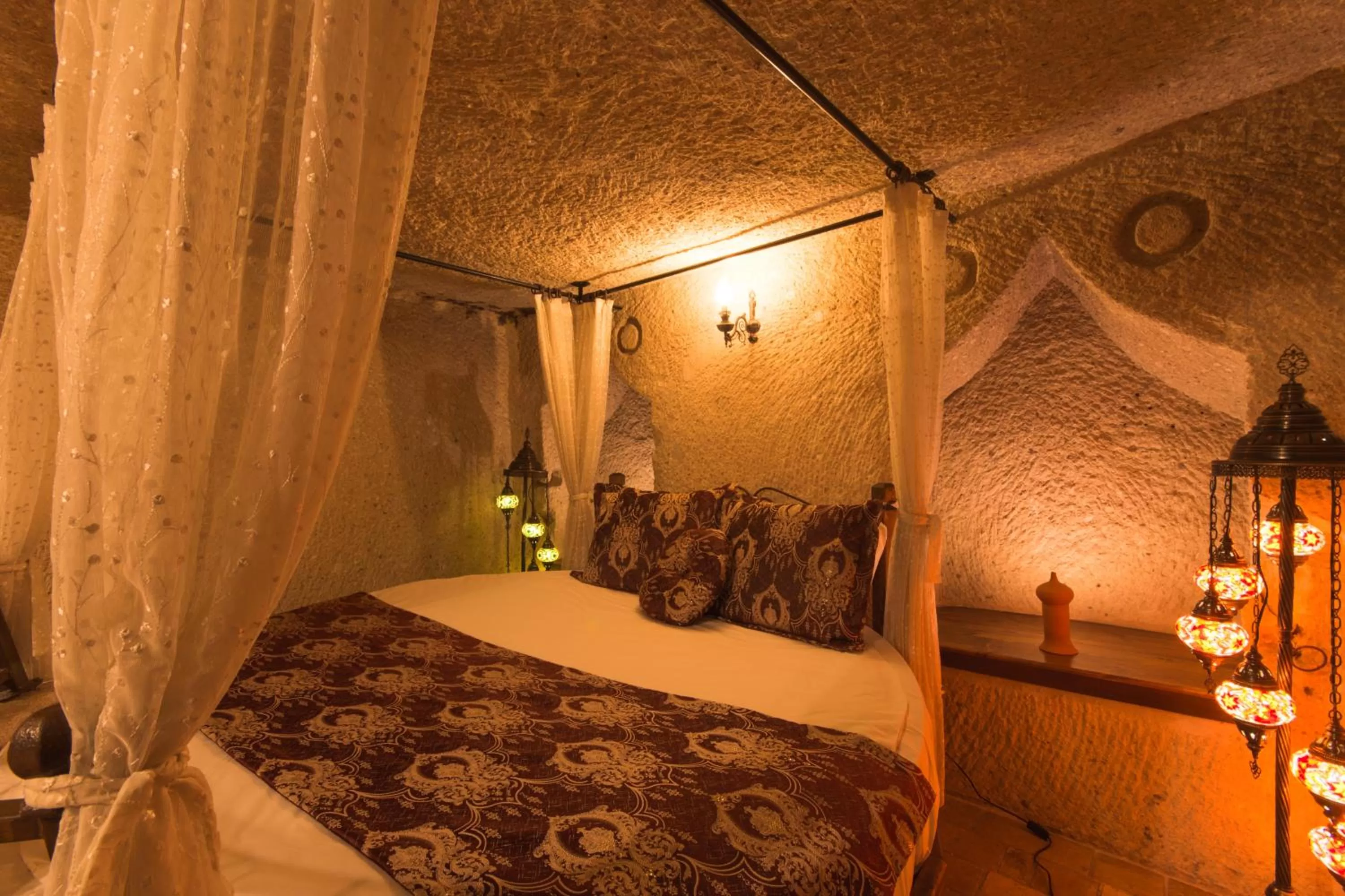 Bed in Adora Cave Suites -