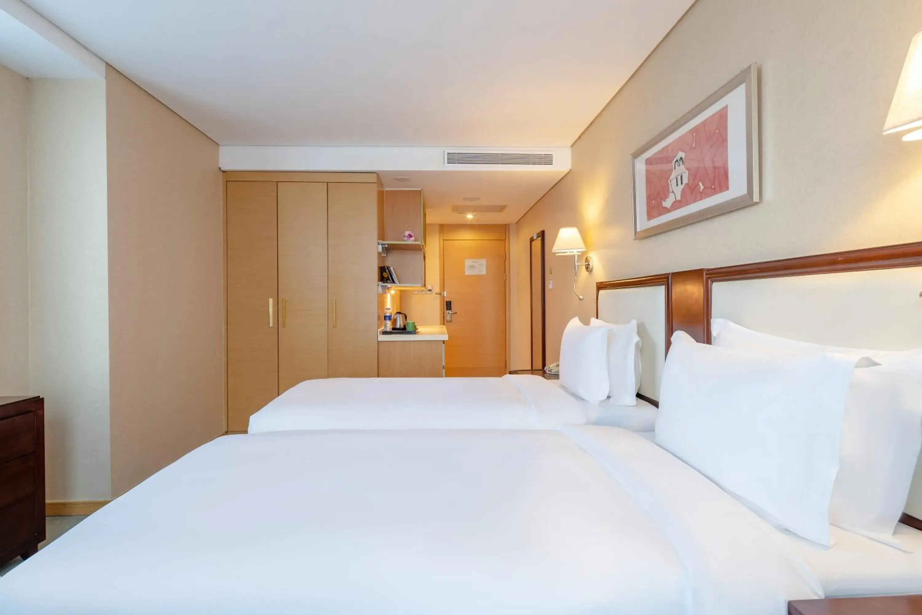 Bed in Regal Plaza Hotel & Residence