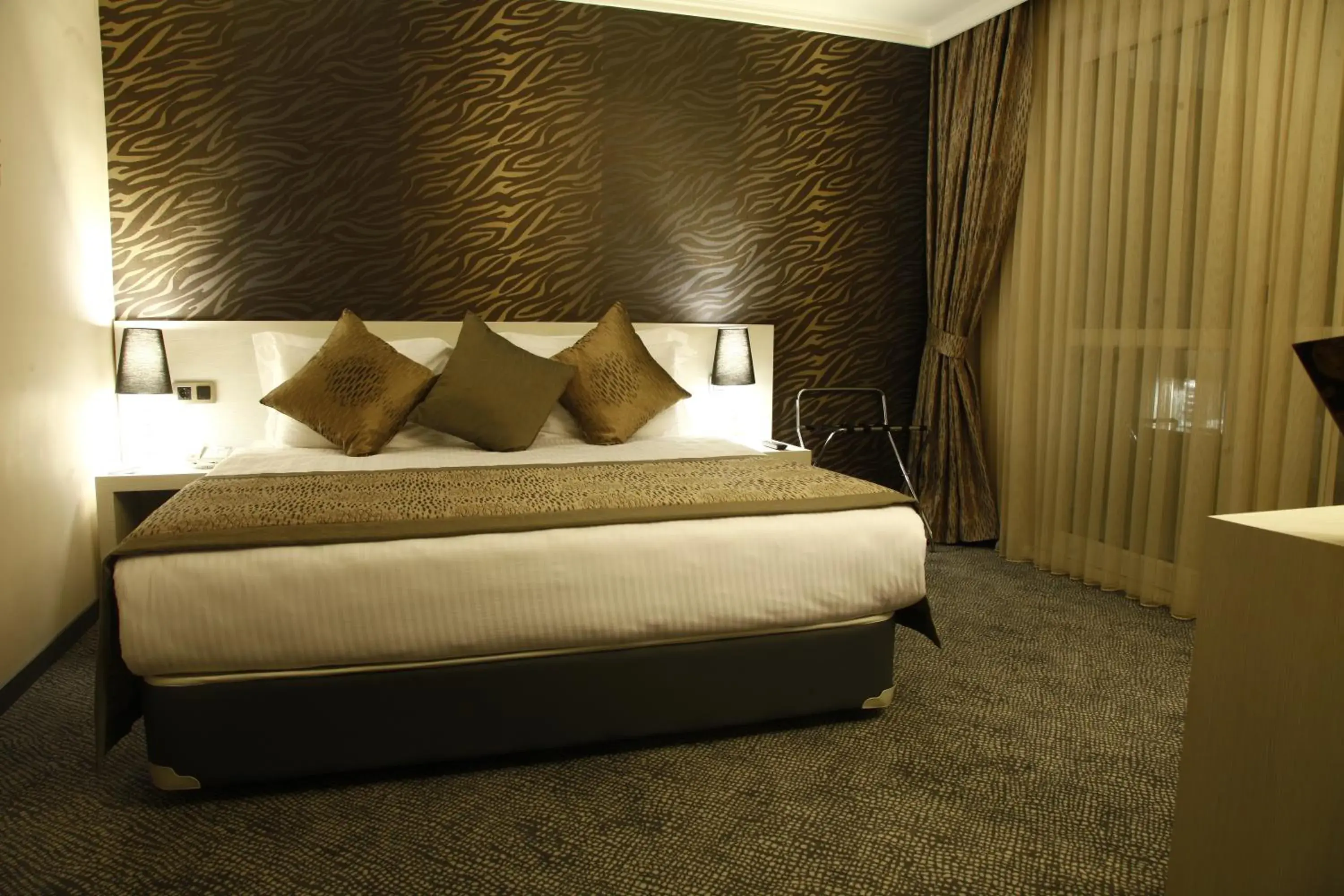 Bed in Koza Suite Hotel