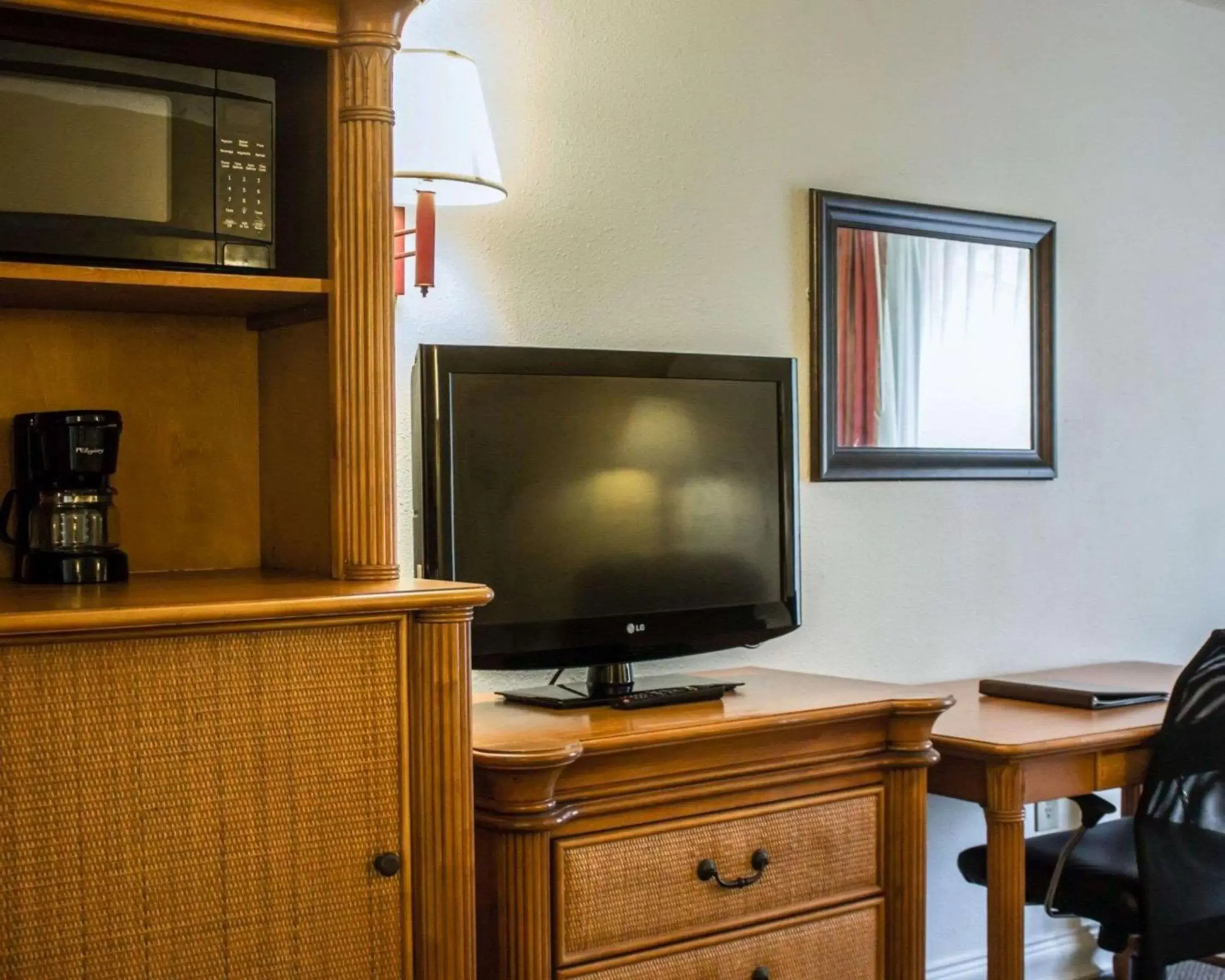 Photo of the whole room, TV/Entertainment Center in Quality Inn & Suites St Augustine Beach