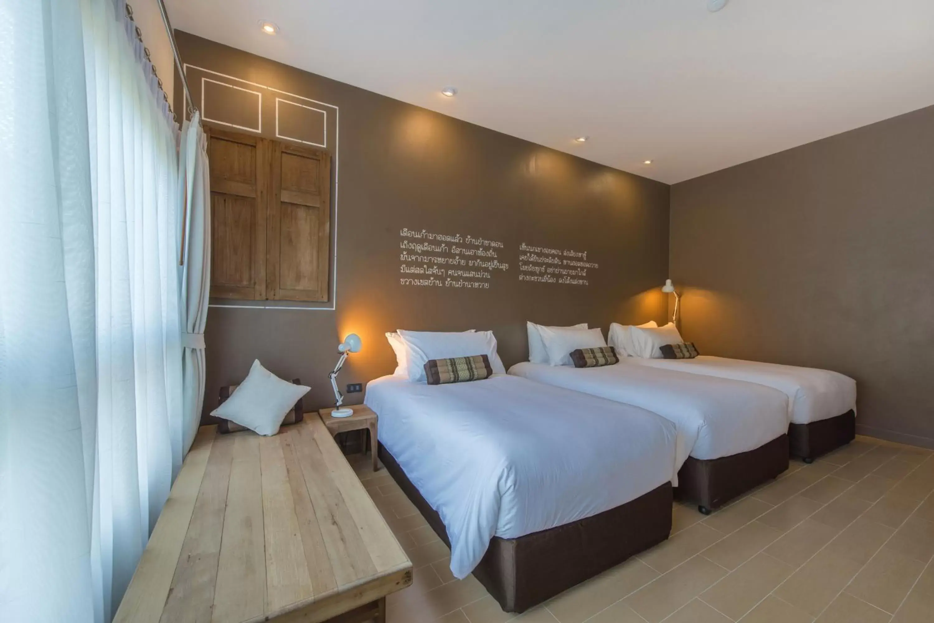 Deluxe Triple Room in Brown House Hotel by Blu Monkey - SHA Extra Plus
