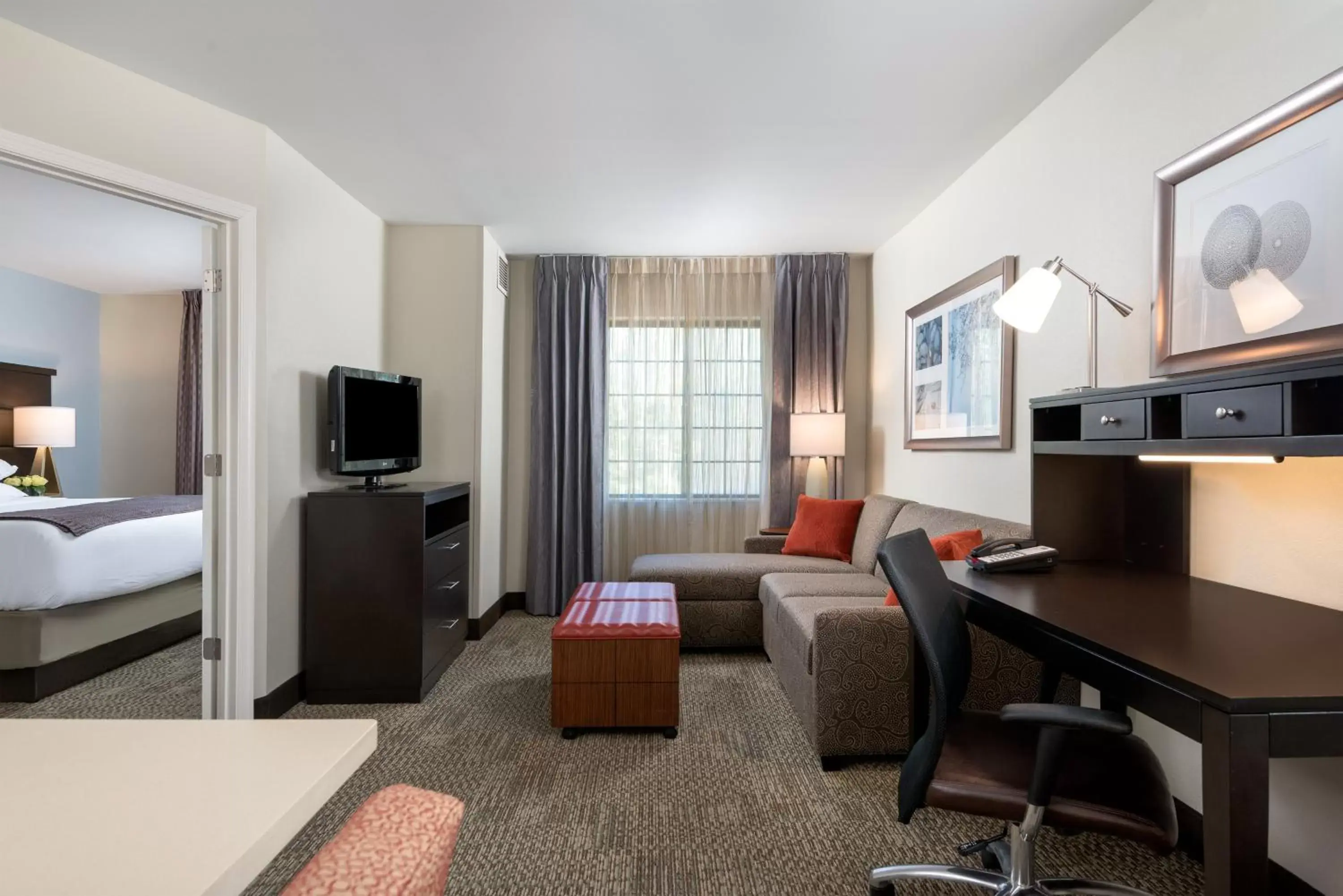Bedroom, Seating Area in Staybridge Suites Chantilly Dulles Airport, an IHG Hotel