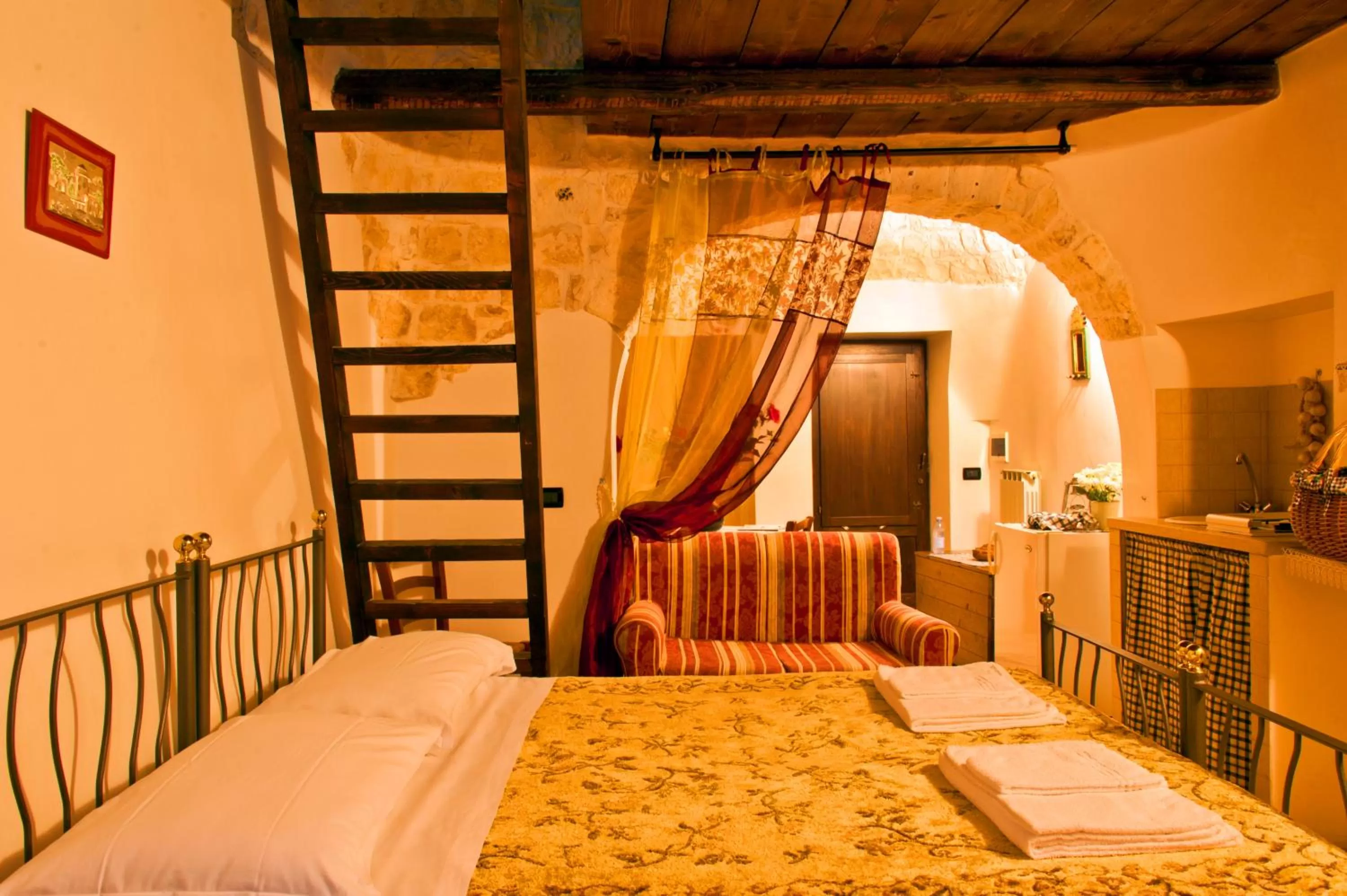 Photo of the whole room, Bed in Giardino Dei Trulli