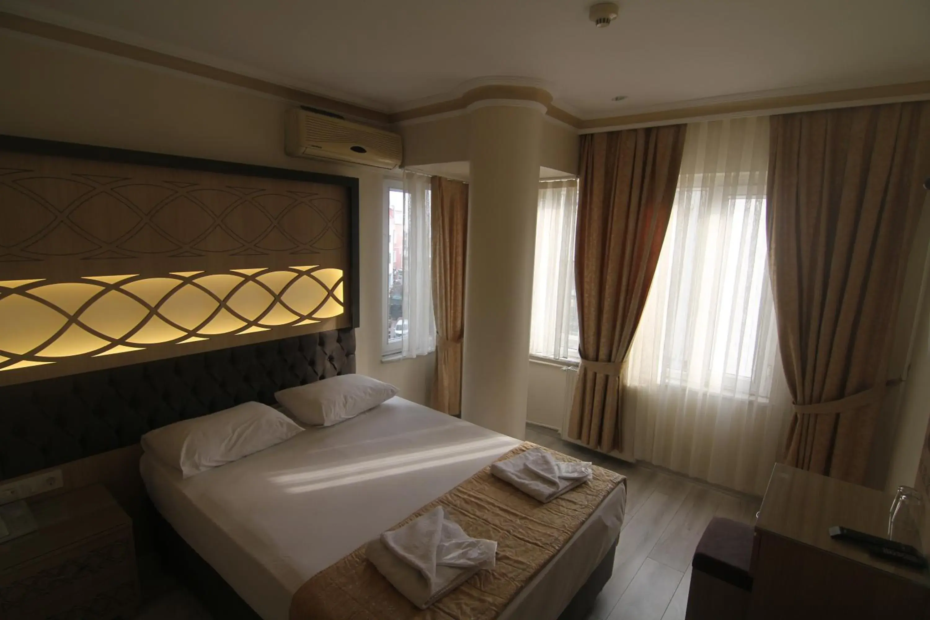 Bedroom, Bed in Grand Liza Hotel