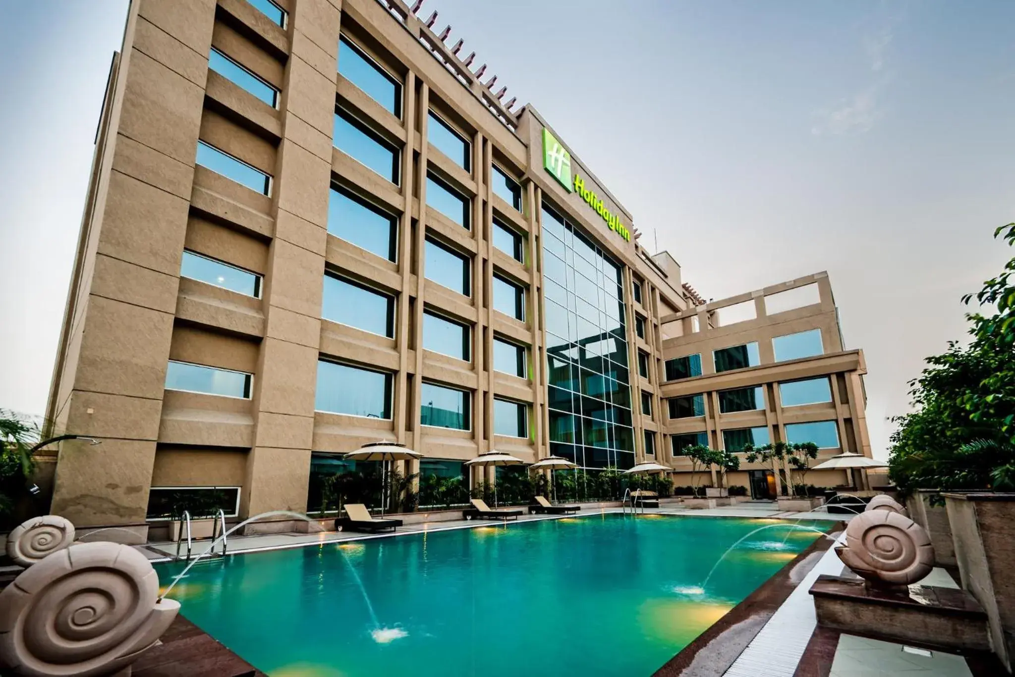 Swimming pool, Property Building in Holiday Inn Amritsar Ranjit Avenue, an IHG Hotel