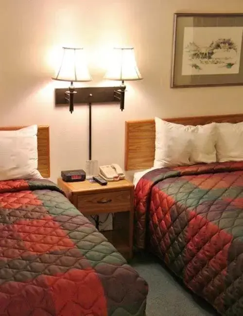 Bed in Colstrip Inn & Suites