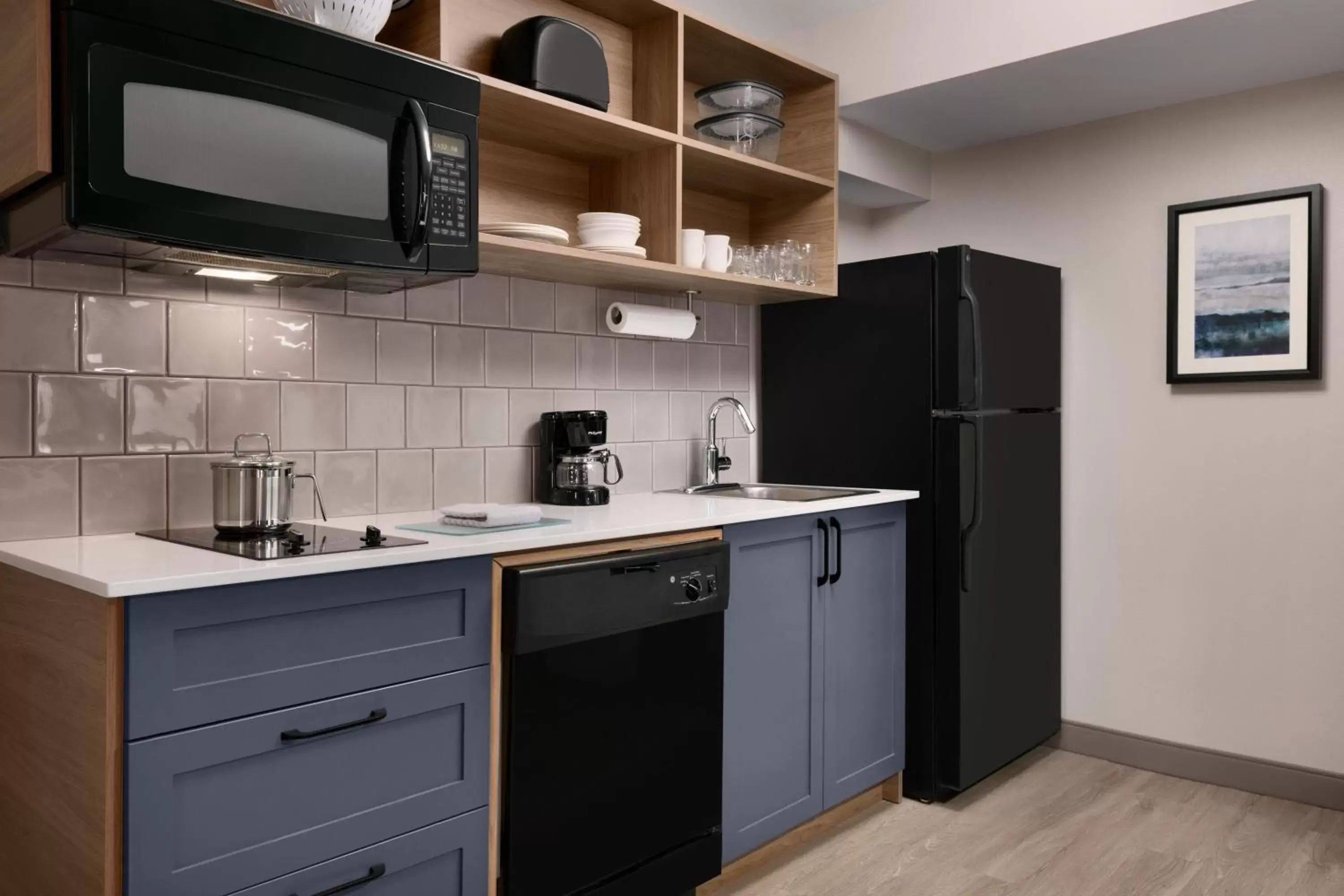 Photo of the whole room, Kitchen/Kitchenette in Candlewood Suites Fayetteville Fort Bragg, an IHG Hotel