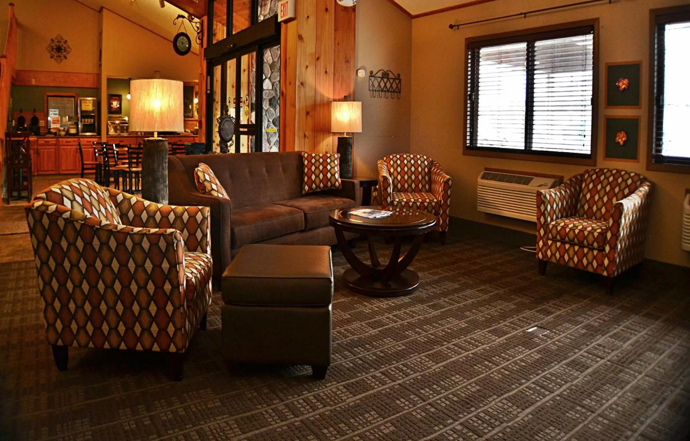 Living room in AmericInn by Wyndham Calumet
