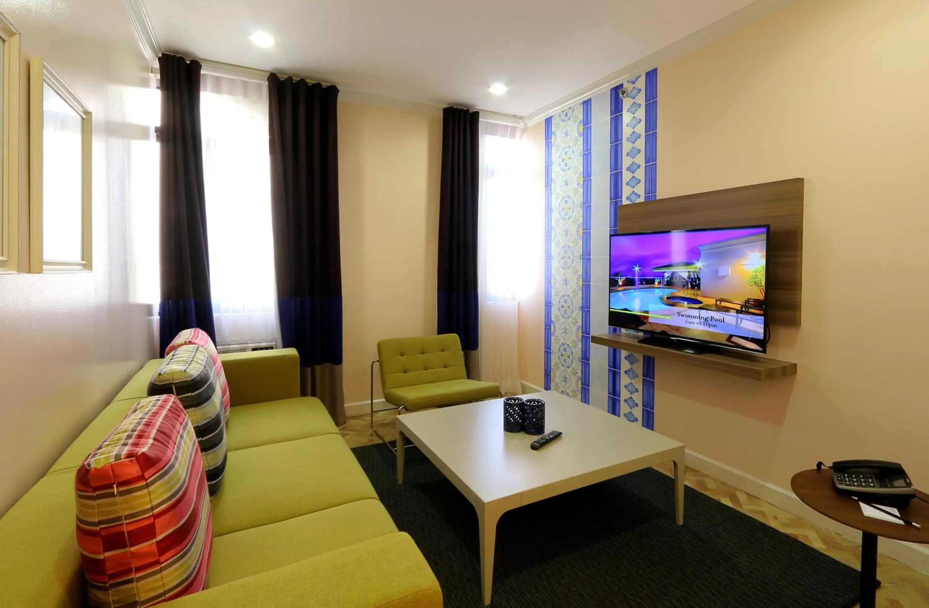 Living room, TV/Entertainment Center in Parque España Residence Hotel Managed by HII