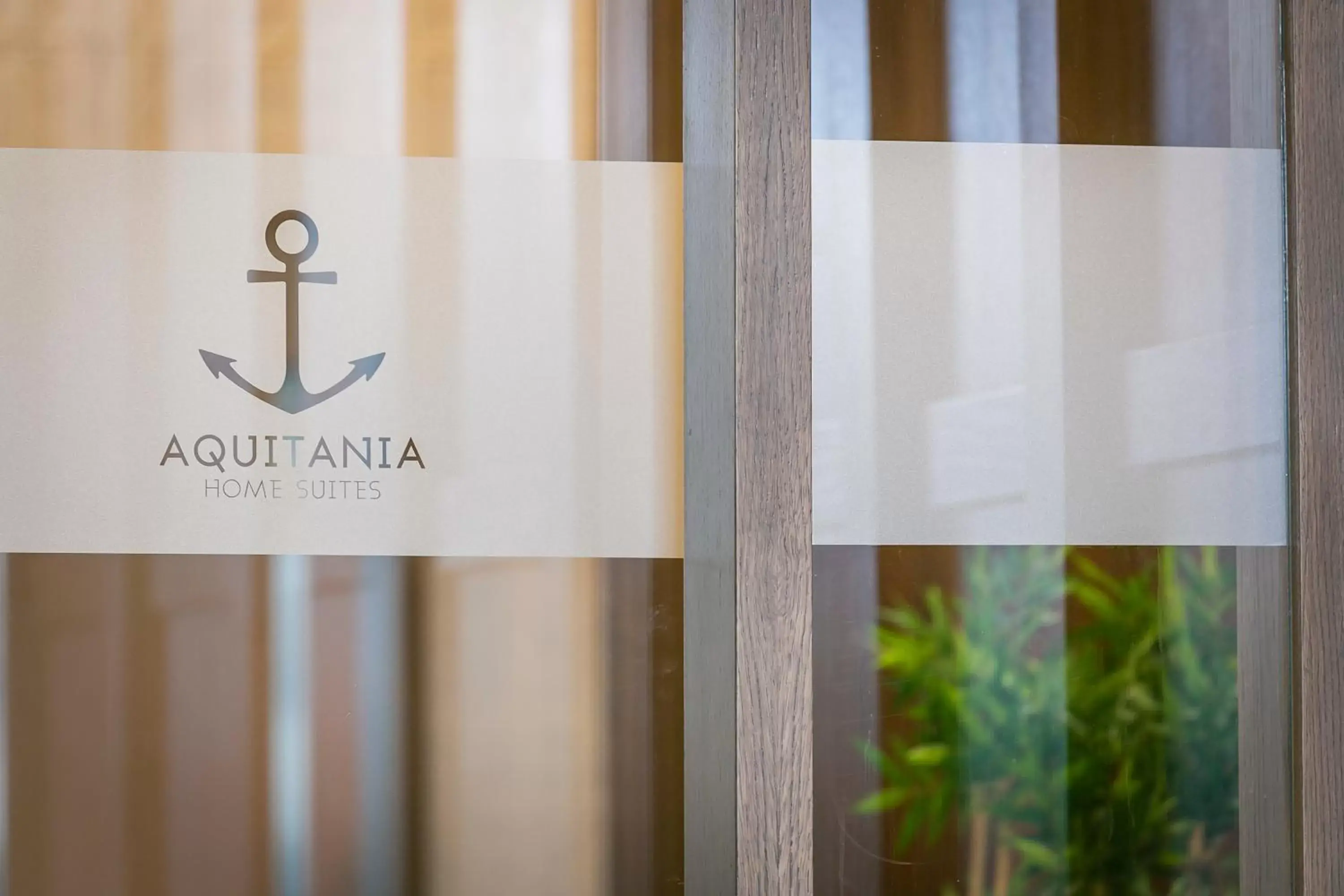 Property logo or sign in Aquitania Home Suites