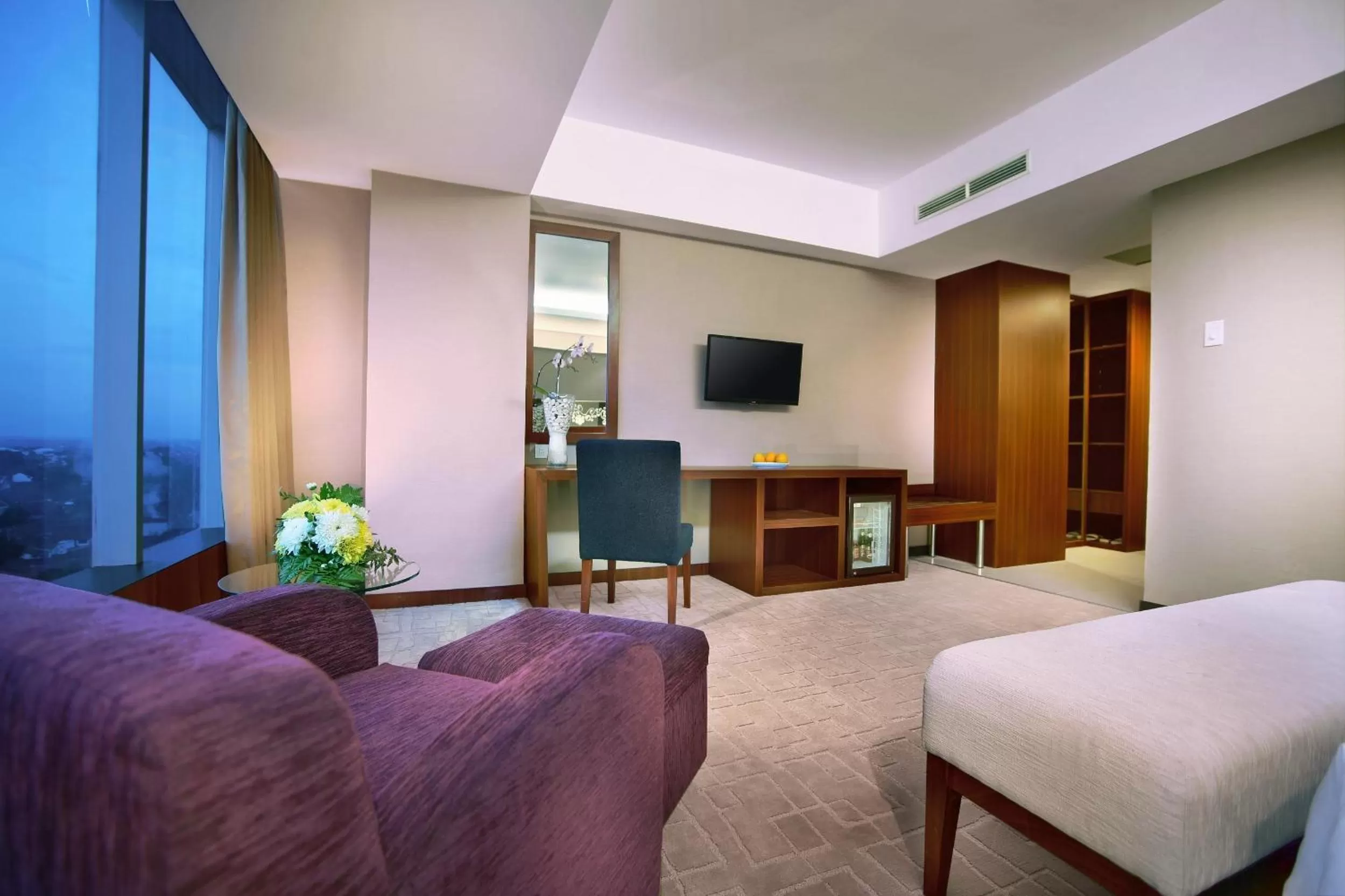 Living room, Bed in Aston Madiun Hotel & Conference Center