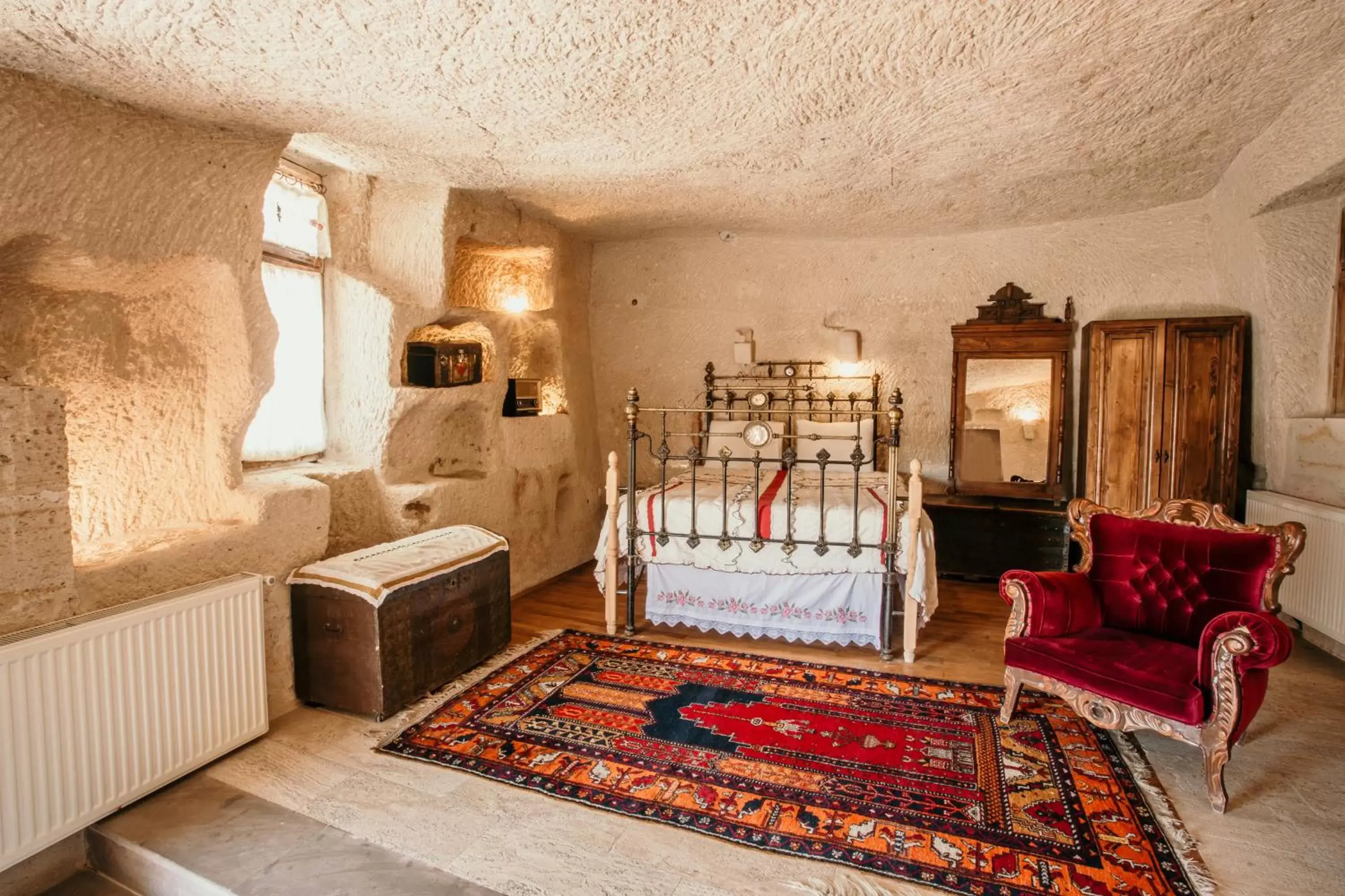 Bed, Seating Area in Village Cave House Hotel