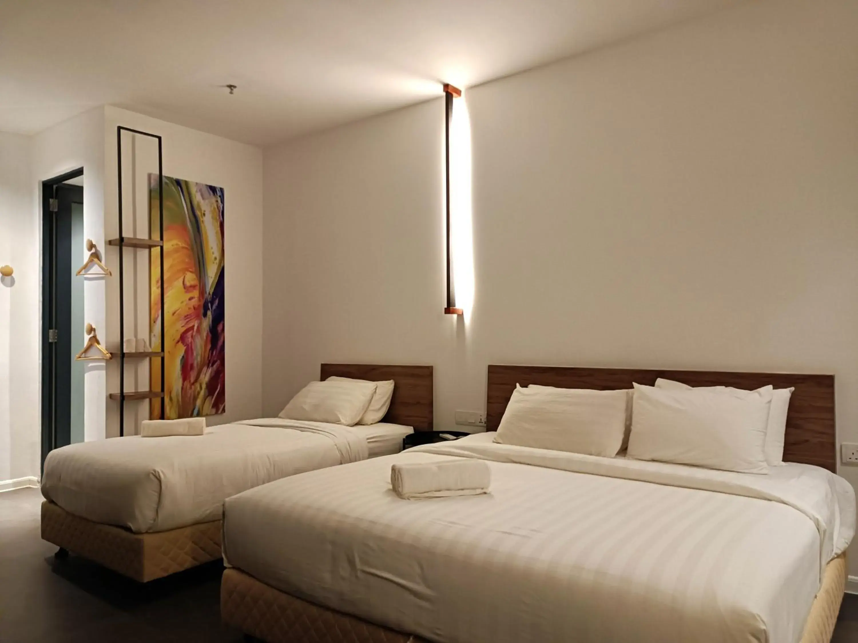 Bed in T+ PREMIUM HOTEL