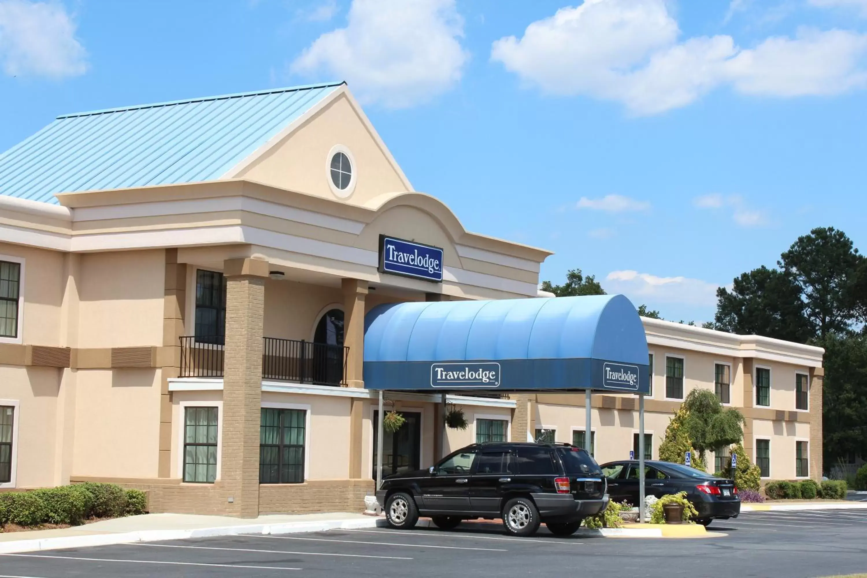 Facade/entrance, Property Building in Travelodge by Wyndham Perry GA
