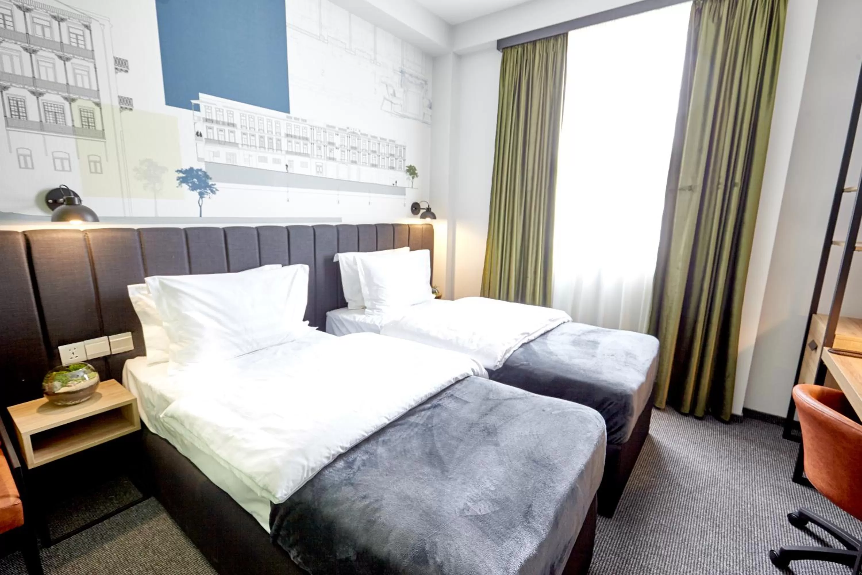 Bed in Graphica Tbilisi Hotel