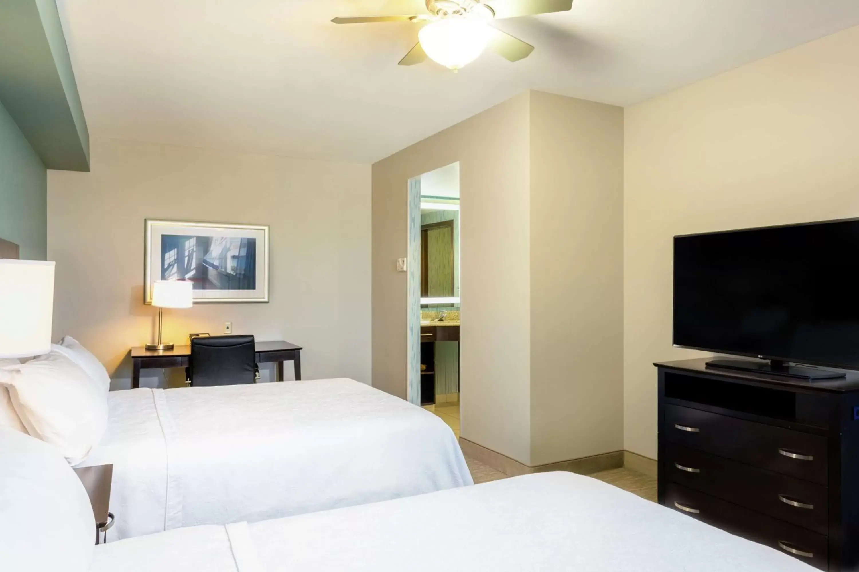 Bedroom, TV/Entertainment Center in Homewood Suites Port Saint Lucie-Tradition