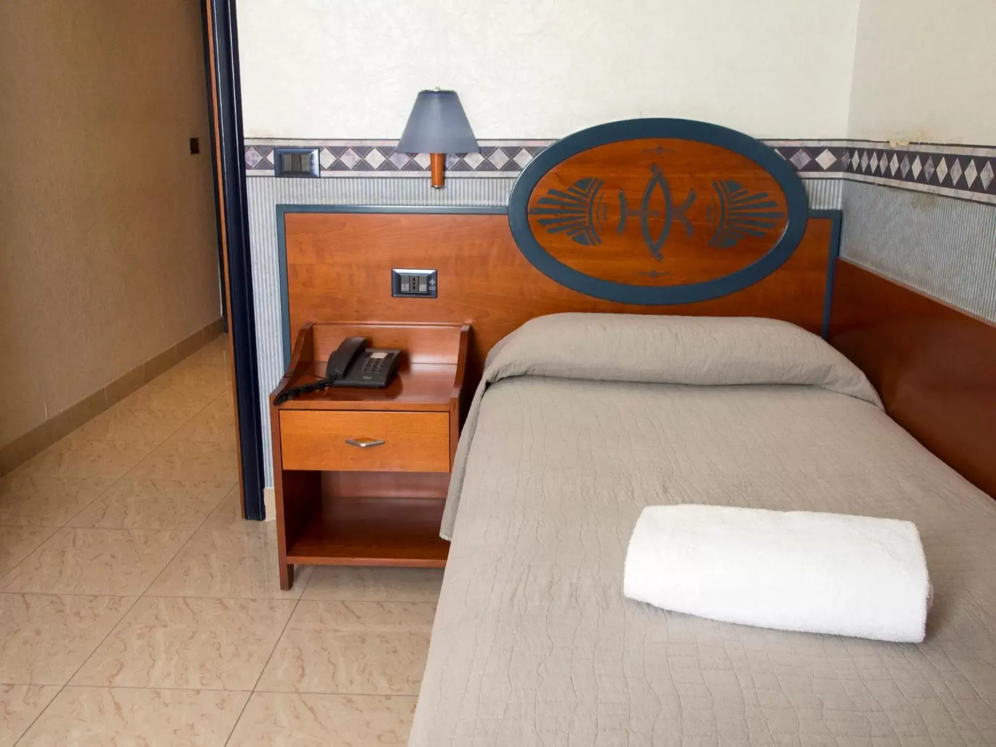 Bed in Hotel Kroma
