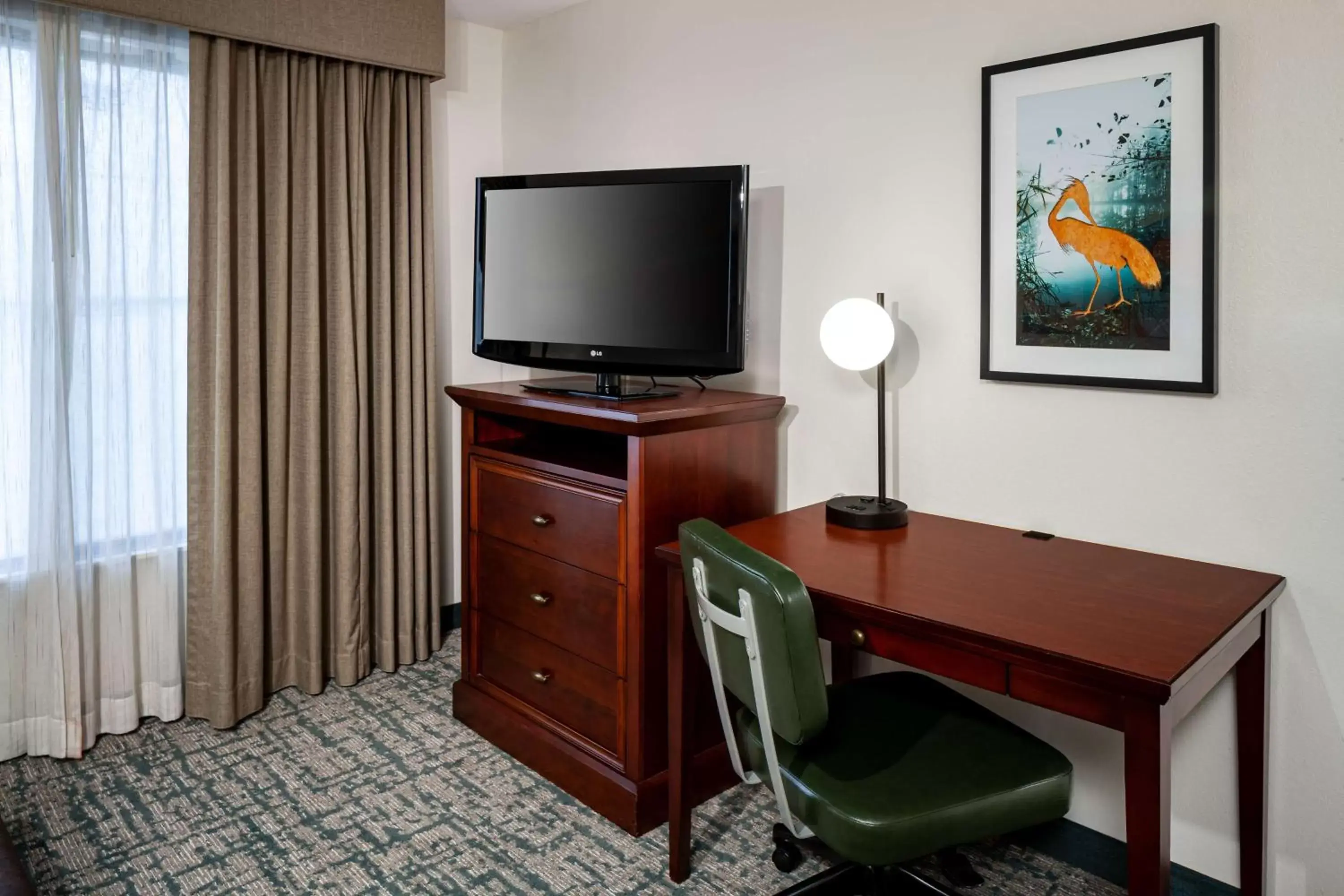 Bedroom, TV/Entertainment Center in Homewood Suites by Hilton Gainesville